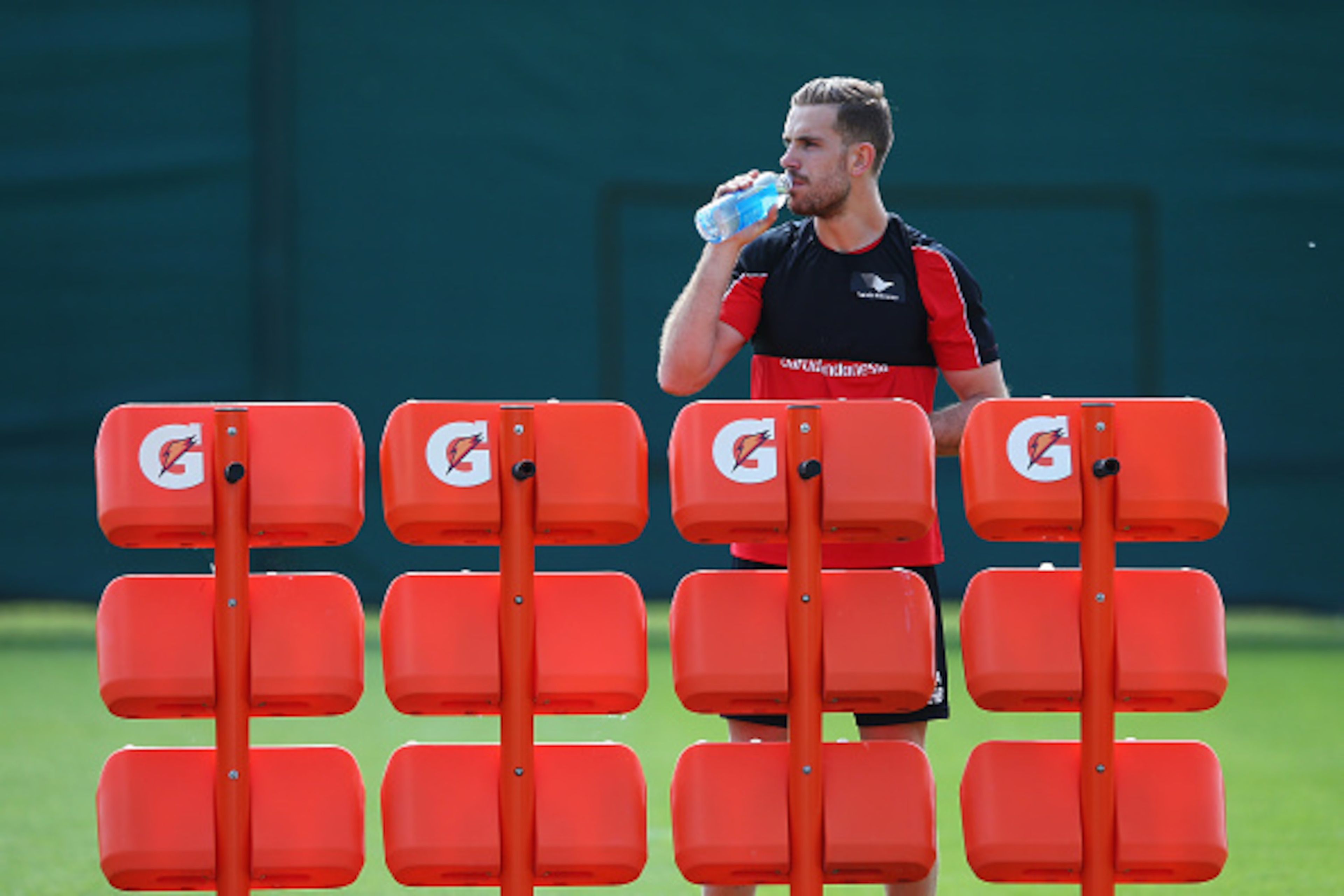 LIVERPOOL, ENGLAND - MAY 13: Jordan Henderson of Liverpool drinks during a training session at the Liverpool UEFA Europa League Cup Final Media Day at Melwood Training Ground on May 13, 2016 in Liverpool, England.  (Photo by Alex Livesey/Getty Images)