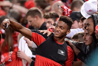 BRISBANE, AUSTRALIA - JULY 16: Joe Gomez takes a selfie with fans during a Liverpool FC training session at Suncorp Stadium on July 16, 2015 in Brisbane, Australia. (Photo by Bradley Kanaris/Getty Images) BRISBANE, AUSTRALIA - JULY 16: Joe Gomez takes a selfie with fans during a Liverpool FC training session at Suncorp Stadium on July 16, 2015 in Brisbane, Australia. (Photo by Bradley Kanaris/Getty Images)