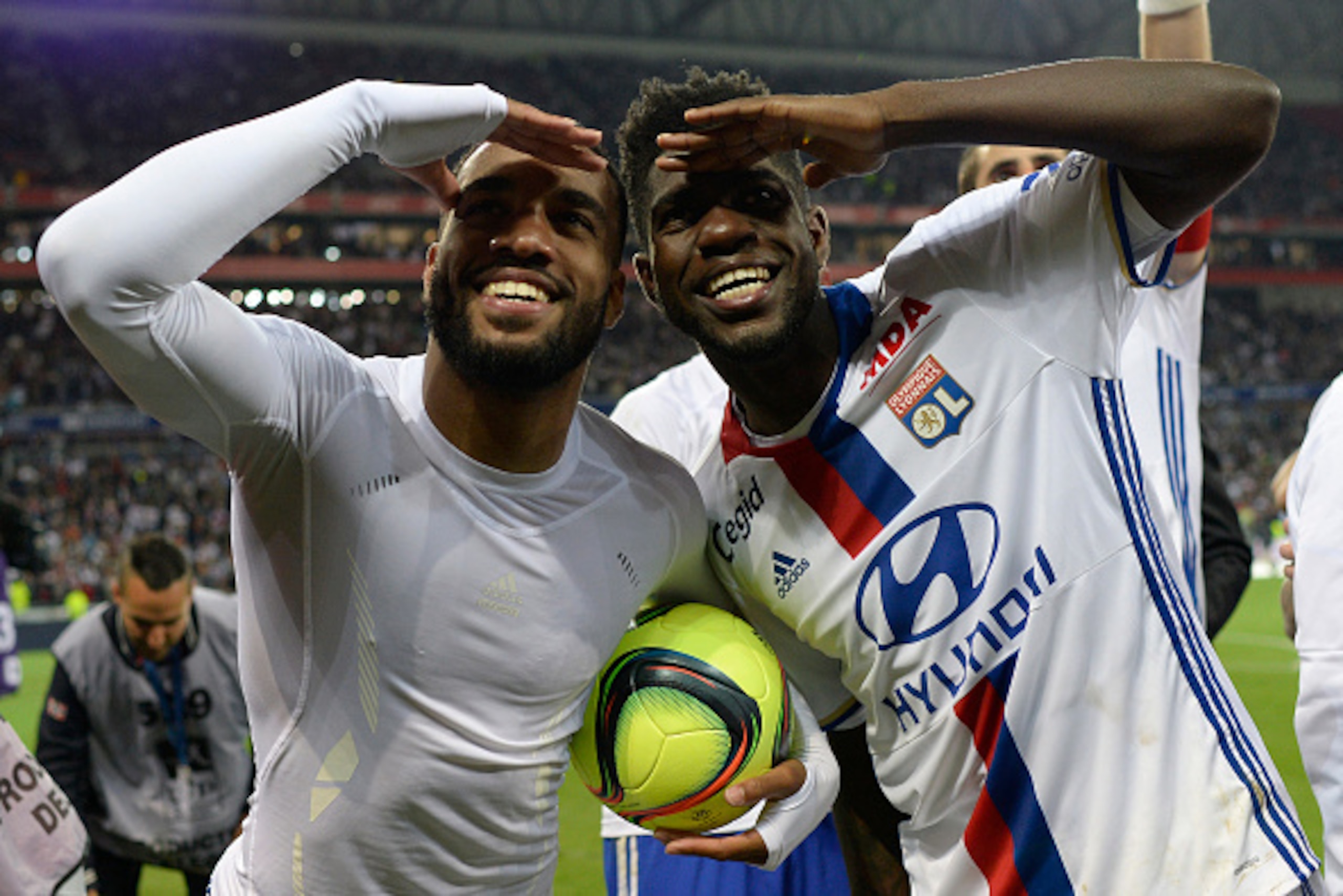 Lyon's French forward Alexandre Lacazette (L) celebrates with Lyon's Cameroonian defender Samuel Umtiti (R) after the French L1 football match between Lyon (OL) and Monaco (ASM) at the Parc de l'Olympique Lyonnais in Decines-Charpieu, central eastern Fran