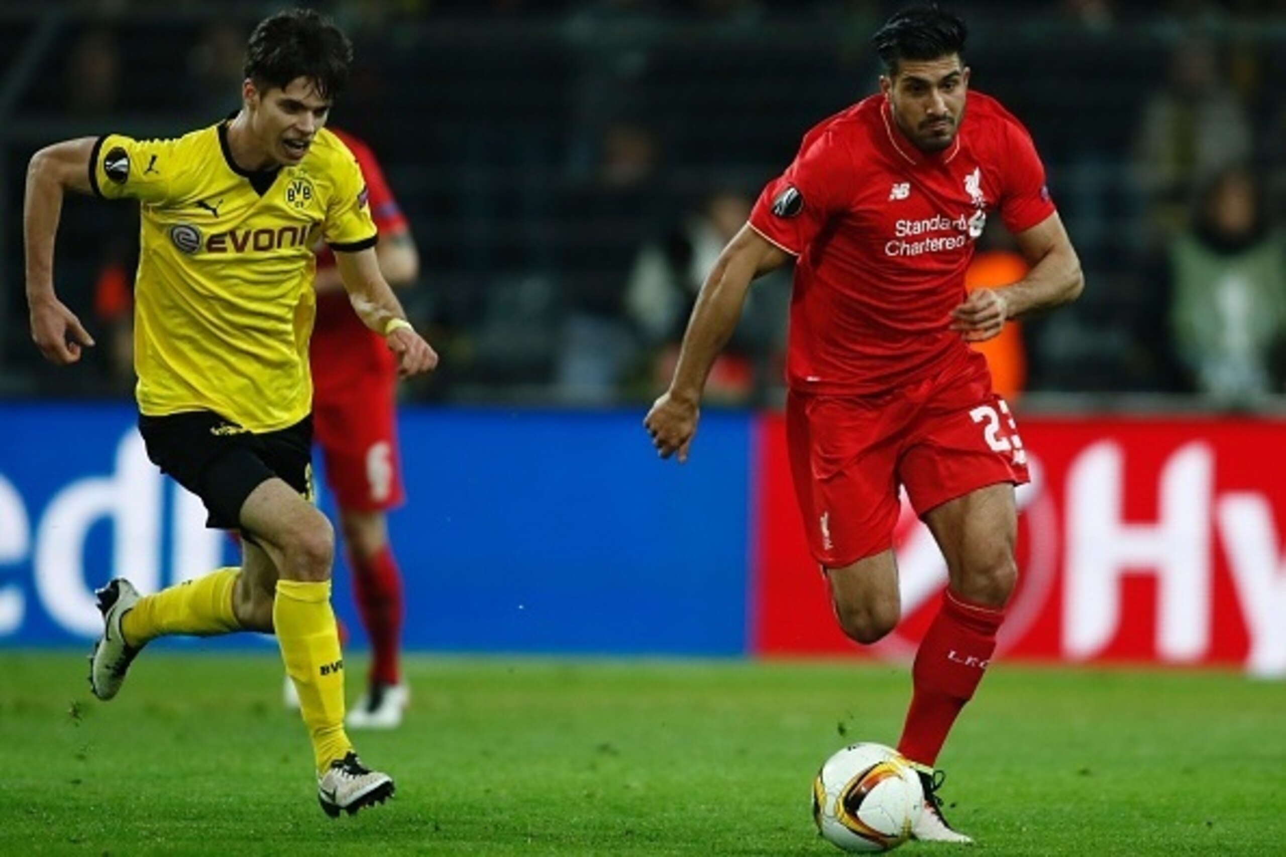 Liverpool's German midfielder Emre Can (R) and Dortmund's midfielder Julian Weigl vie for the ball during the UEFA Europe League quarter-final, first-leg football match Borussia Dortmund vs Liverpool FC in Dortmund, western Germany on April 7, 2016. / AFP