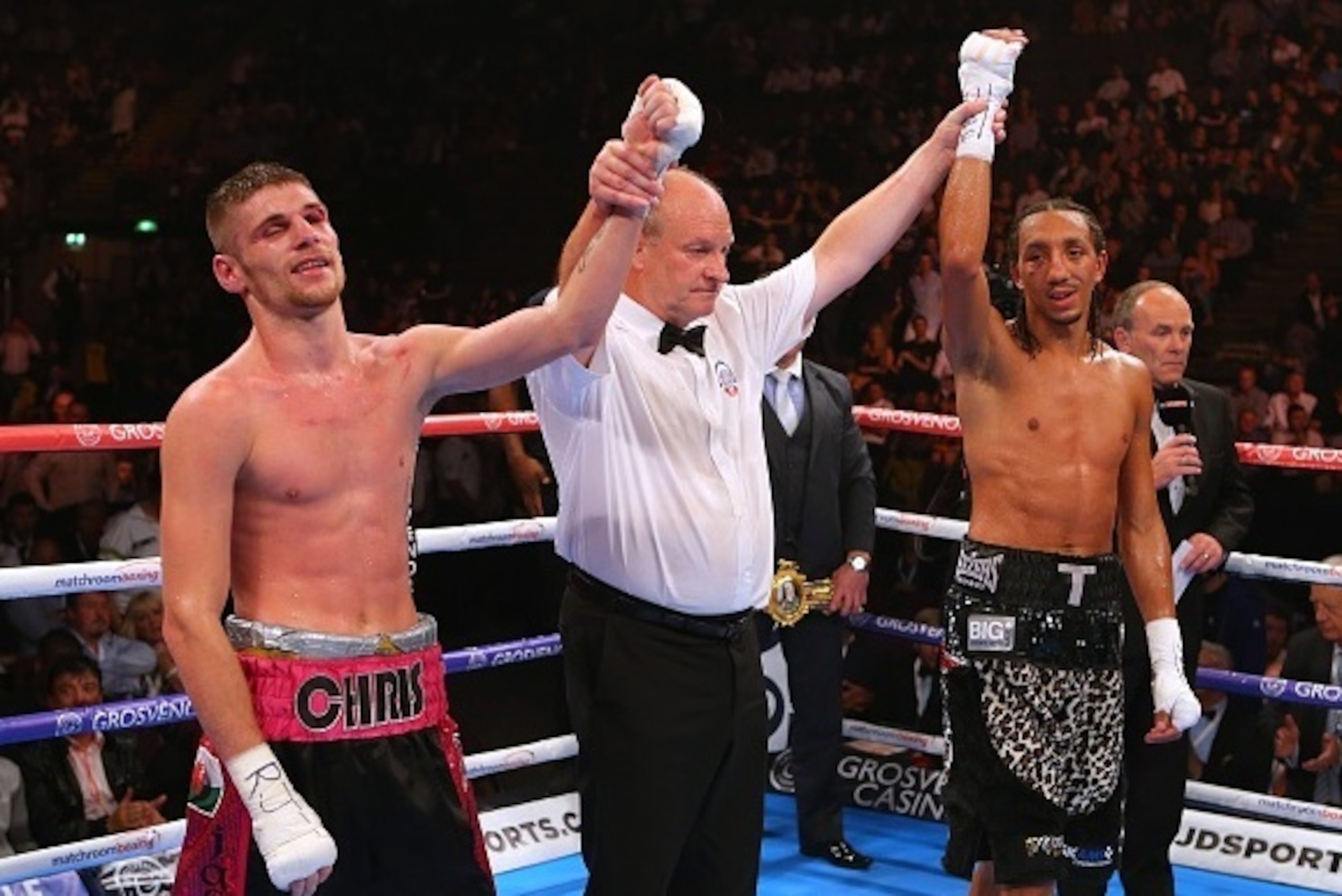 MANCHESTER, ENGLAND - JULY 18: Chris Jenkins and Tyrone Nurse have their arms raised as a draw in announced as the result during their British Light Welterweight Championship at the Manchester Arena on July 18, 2015 in Manchester, England. (Photo by Dave 