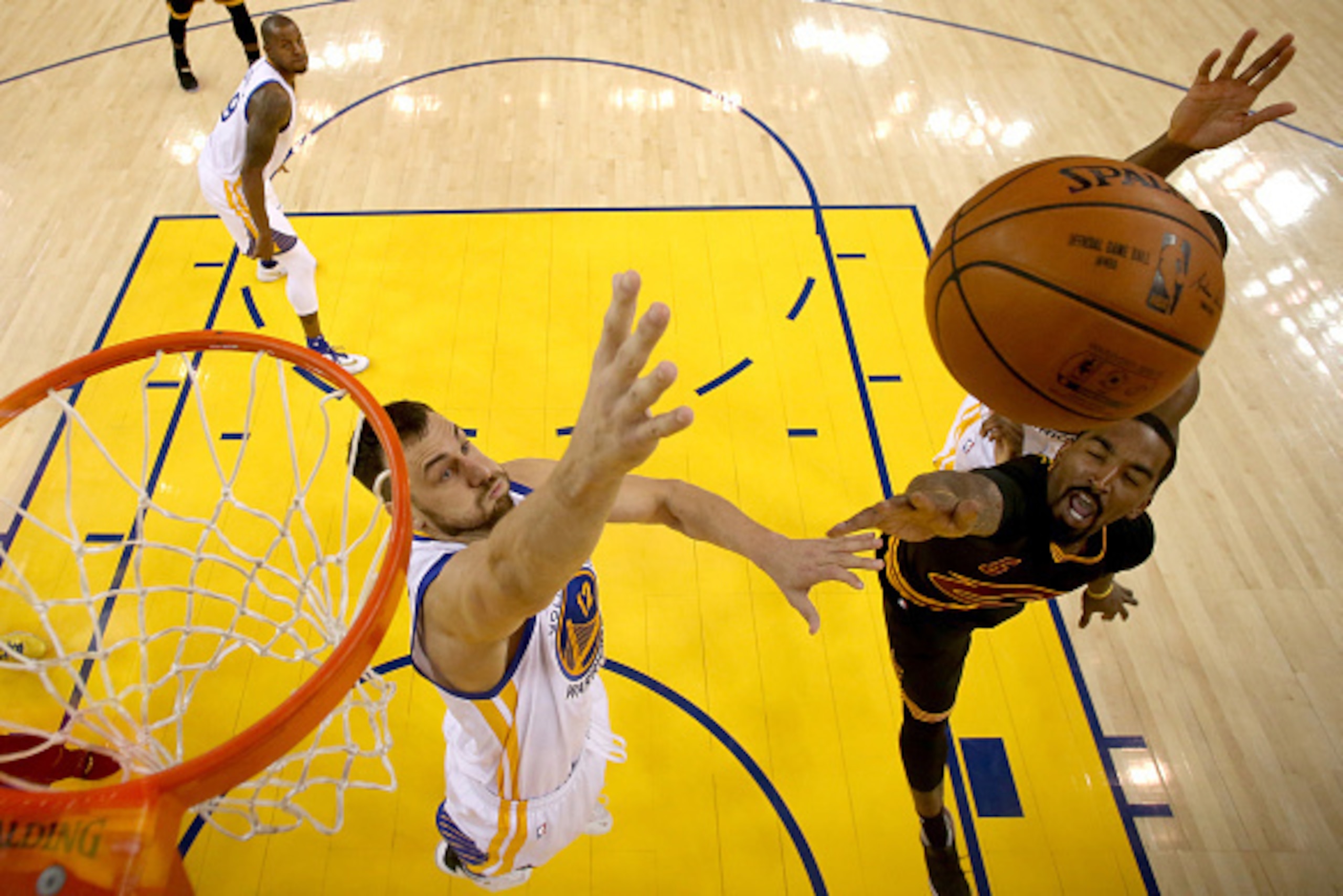 OAKLAND, CA - JUNE 13:  J.R. Smith #5 of the Cleveland Cavaliers goes up for a shot against Andrew Bogut #12 of the Golden State Warriors in the second half in Game 5 of the 2016 NBA Finals at ORACLE Arena on June 13, 2016 in Oakland, California. NOTE TO 