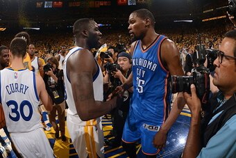 OAKLAND, CA - MAY 30:  Draymond Green #23 of the Golden State Warriors shakes hands with Kevin Durant #35 of the Oklahoma City Thunder after Game Seven of the Western Conference Finals during the 2016 NBA Playoffs on May 30, 2016 at ORACLE Arena in Oaklan