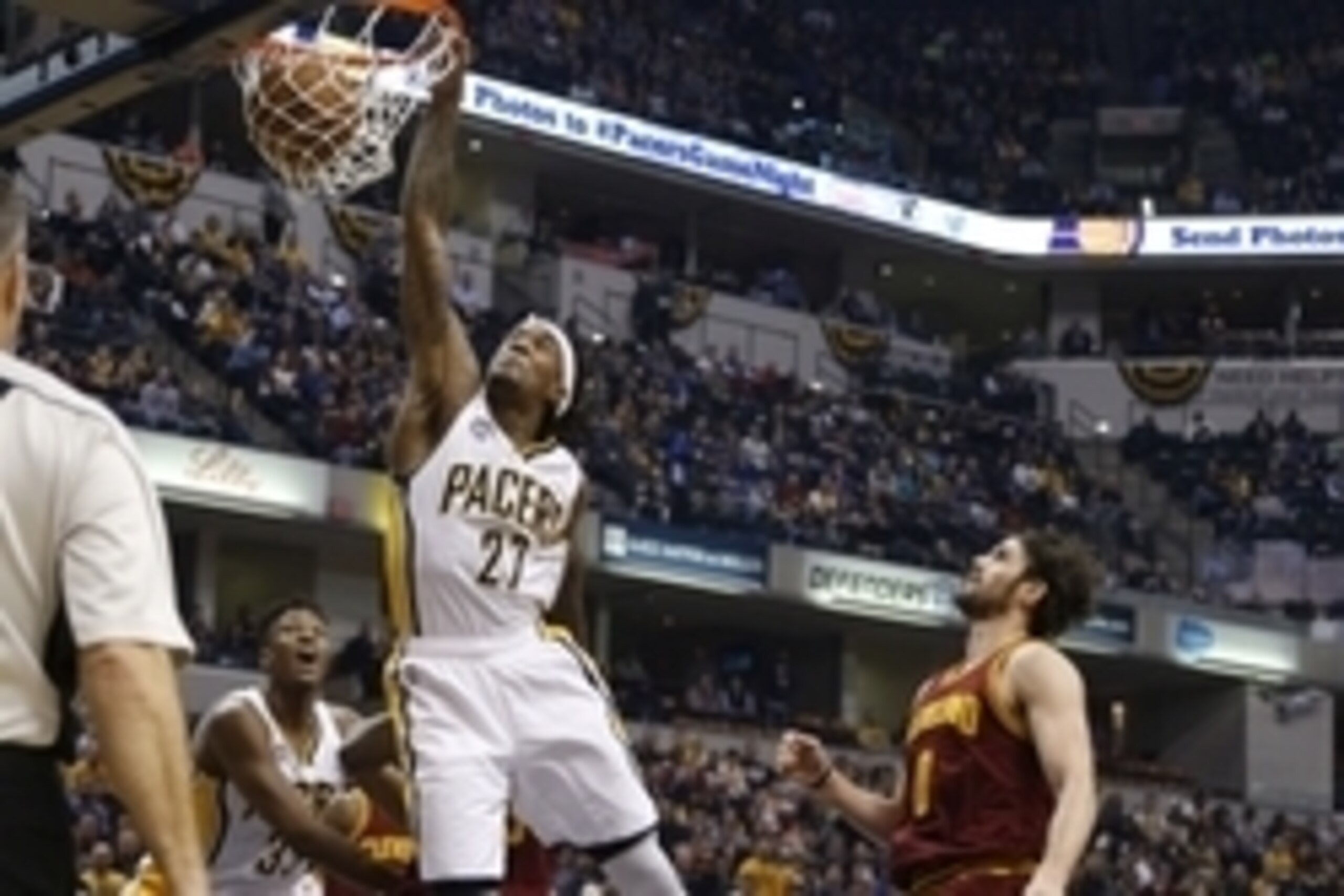 Feb 1, 2016; Indianapolis, IN, USA; Indiana Pacers center Jordan Hill (27) dunks the ball past Cleveland Cavaliers forward Kevin Love (0) during the first half at Bankers Life Fieldhouse. Mandatory Credit: Brian Spurlock-USA TODAY Sports