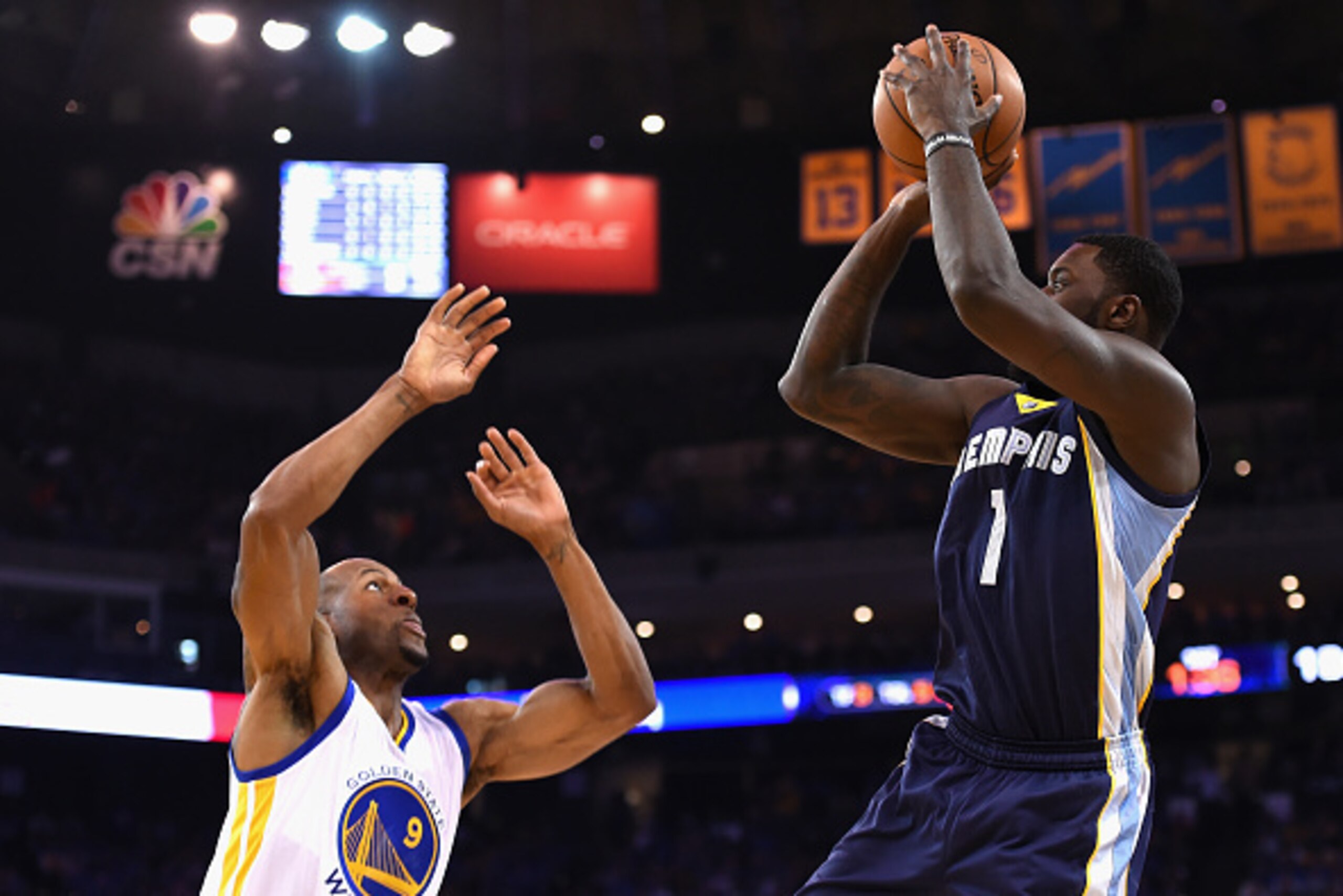OAKLAND, CA - APRIL 13:  Lance Stephenson #1 of the Memphis Grizzlies shoots the ball against Andre Iguodala #9 of the Golden State Warriors in the first half during the game at ORACLE Arena on April 13, 2016 in Oakland, California.  (Photo by Thearon W. 