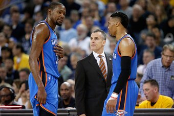 OAKLAND, CA - MARCH 03:  Kevin Durant #35 and Russell Westbrook #0 of the Oklahoma City Thunder talk to head coach Billy Donovan during their game against the Golden State Warriors at ORACLE Arena on March 3, 2016 in Oakland, California.  NOTE TO USER: Us