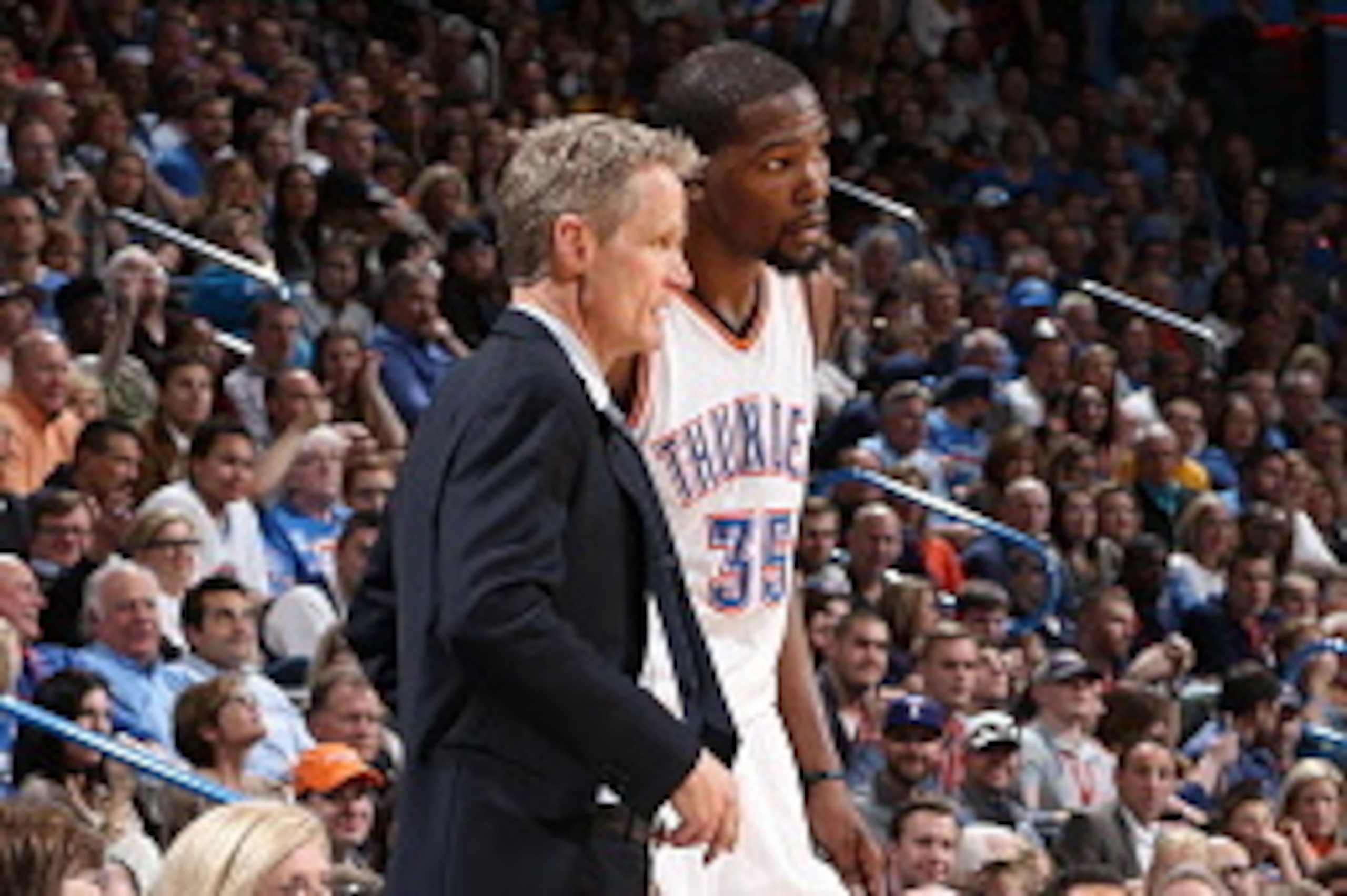 OKLAHOMA CITY, OK - FEBRUARY 27:  Head Coach Steve Kerr of the Golden State Warriors talks with Kevin Durant #35 of the Oklahoma City Thunder during the game on February 27, 2016 at Chesapeake Energy Arena in Oklahoma City, Oklahoma. NOTE TO USER: User ex