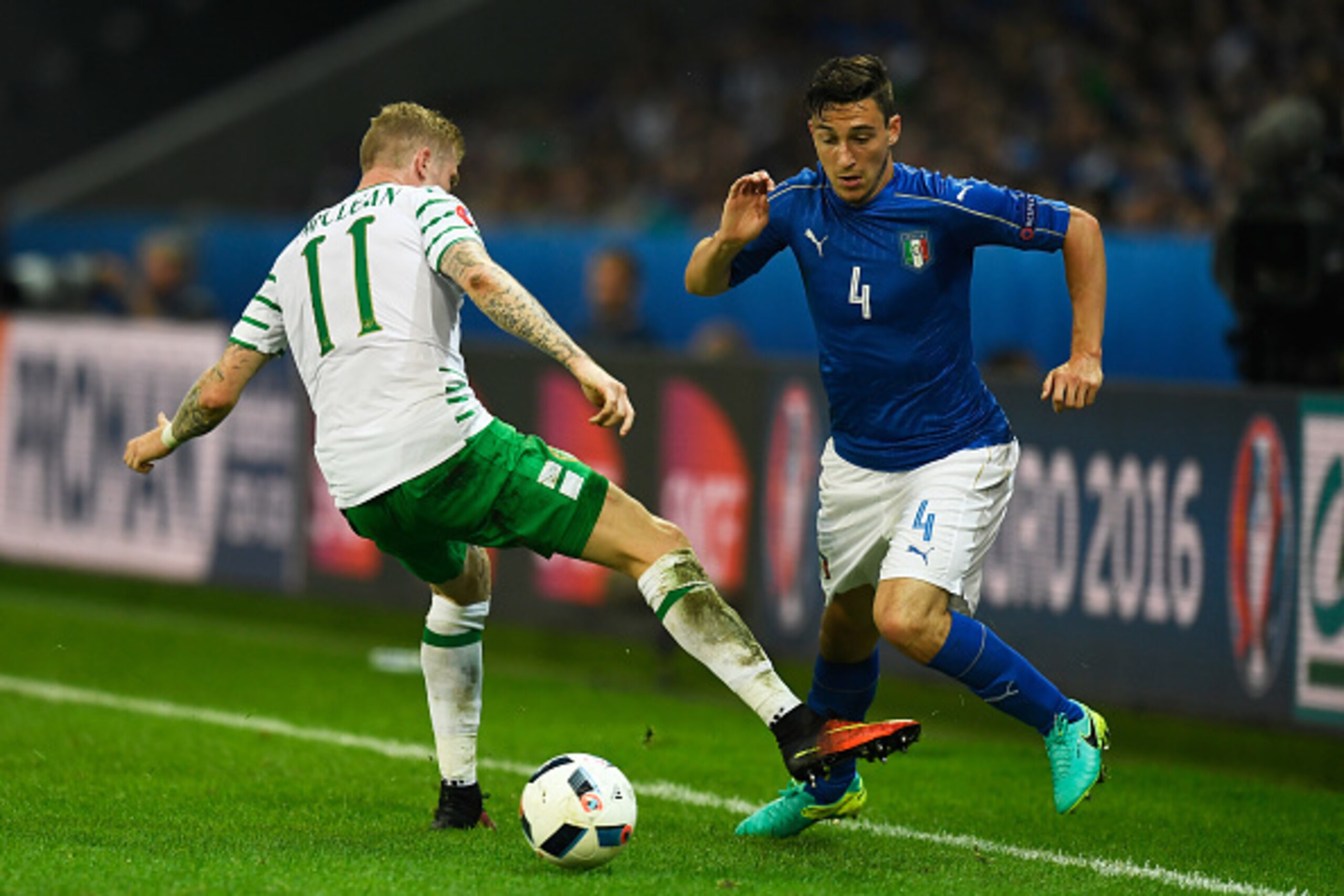 LILLE, FRANCE - JUNE 22: Matteo Darmian of Italy and James McClean of Republic of Ireland compete for the ball during the UEFA EURO 2016 Group E match between Italy and Republic of Ireland at Stade Pierre-Mauroy on June 22, 2016 in Lille, France.  (Photo 