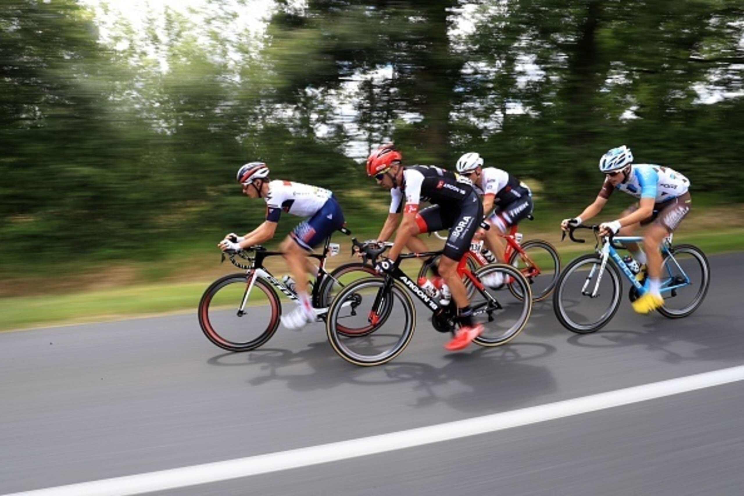 Spain's Markel Irizar, Germany's Andreas Schillinger, Belgium's Oliver Naesen, and French Alexis Gougeard break away from the pack during the 237,5 km fouth stage of the 103rd edition of the Tour de France cycling race on July 5, 2016 between Saumur and L