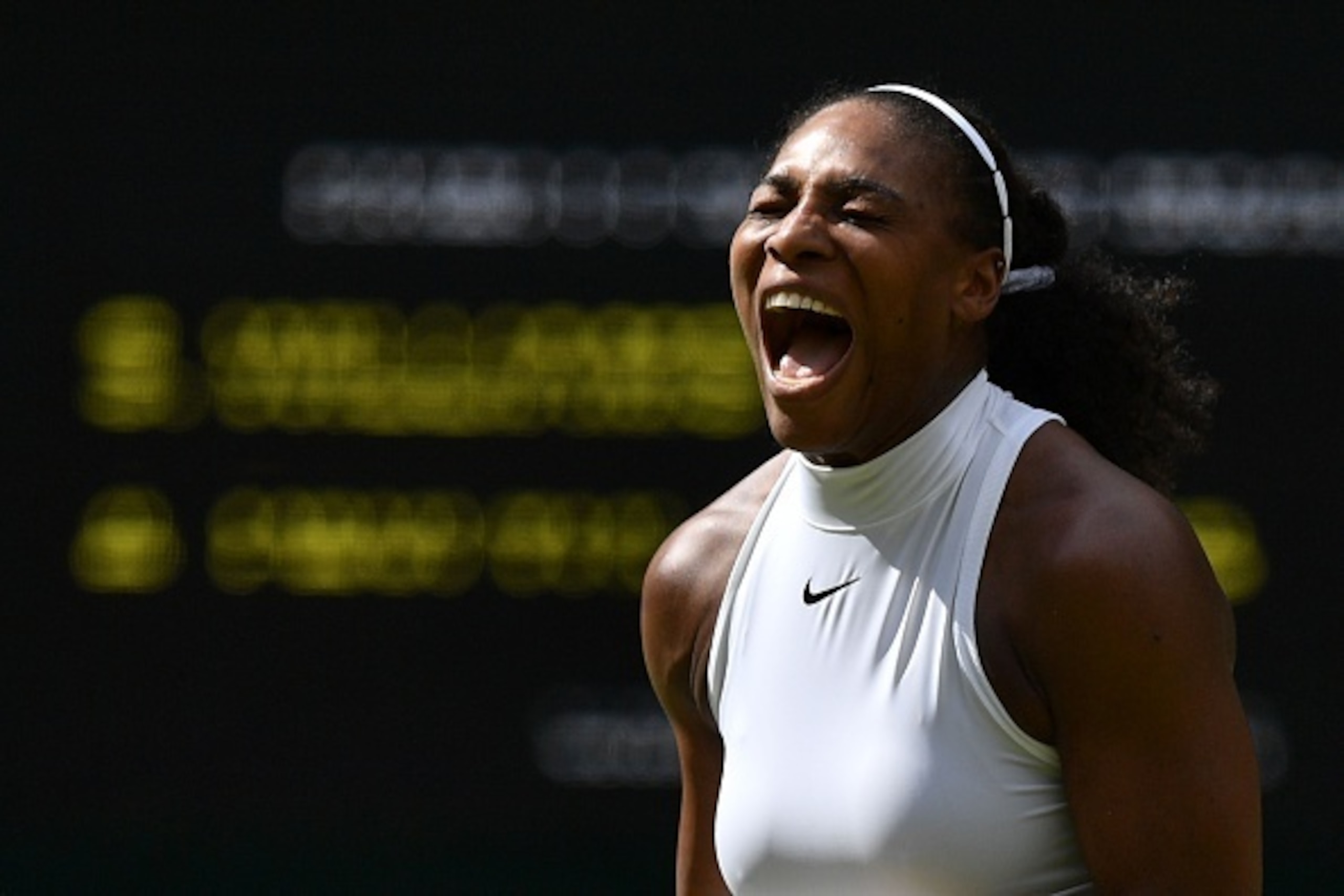 US player Serena Williams reacts after a point against Russia's Anastasia Pavlyuchenkova during their women's singles quarter-final match on the ninth day of the 2016 Wimbledon Championships at The All England Lawn Tennis Club in Wimbledon, southwest Lond
