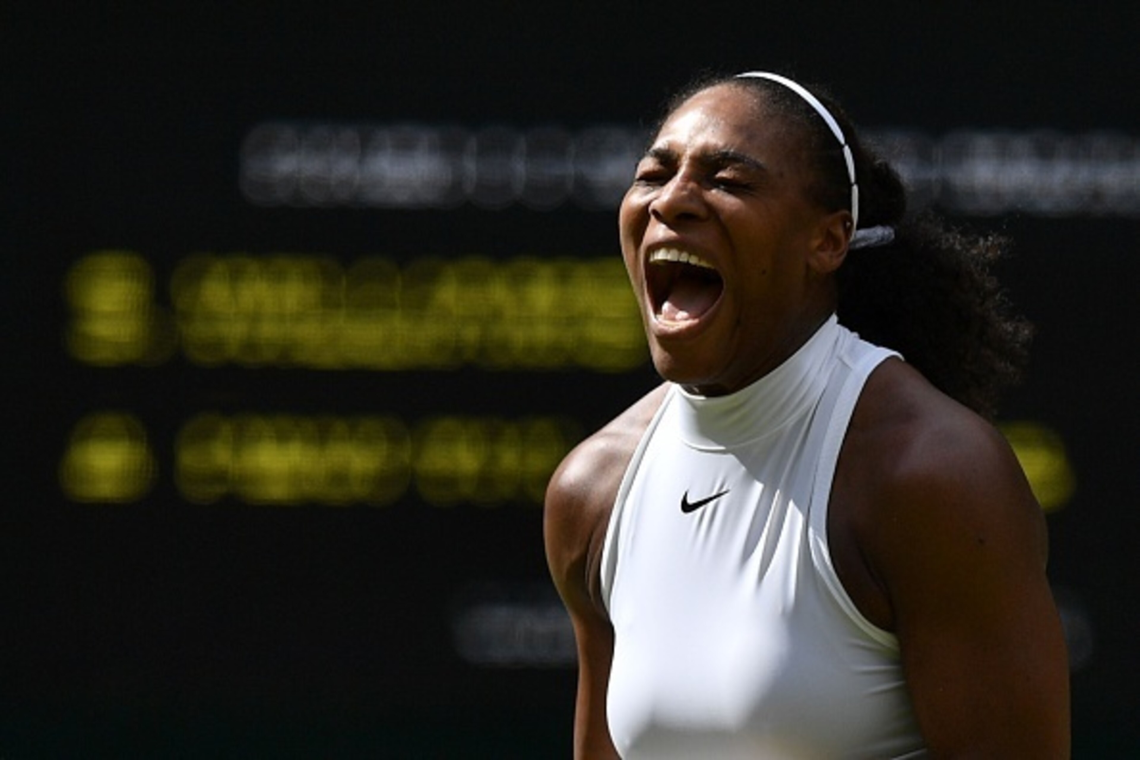 US player Serena Williams reacts after a point against Russia's Anastasia Pavlyuchenkova during their women's singles quarter-final match on the ninth day of the 2016 Wimbledon Championships at The All England Lawn Tennis Club in Wimbledon, southwest Lond
