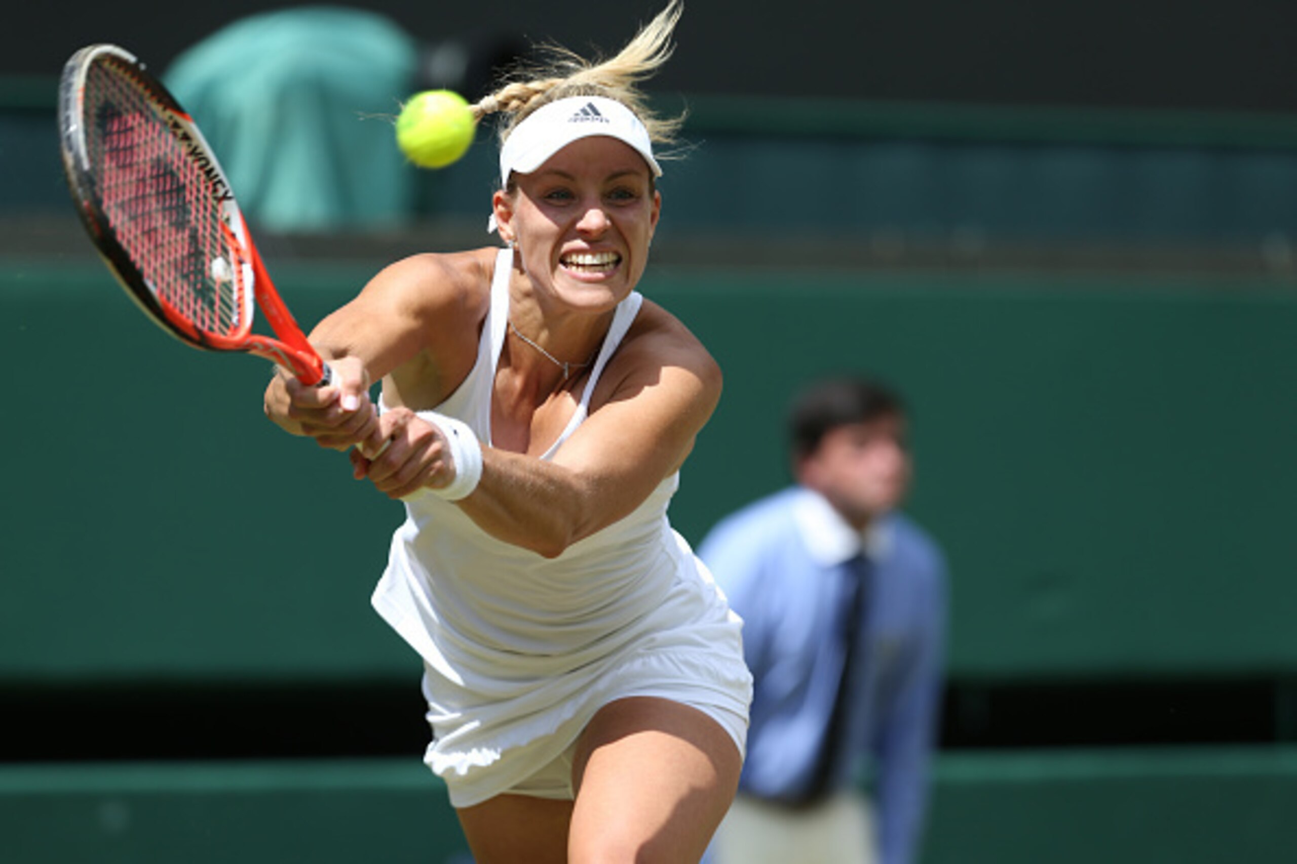 LONDON, ENGLAND - JULY 05:  Angelique Kerber of Germany in action during her victory over Simona Halep of Romania in their Ladies Singles Quarter-Final match on day eight of the Wimbledon Lawn Tennis Championships at the All England Lawn Tennis and Croque