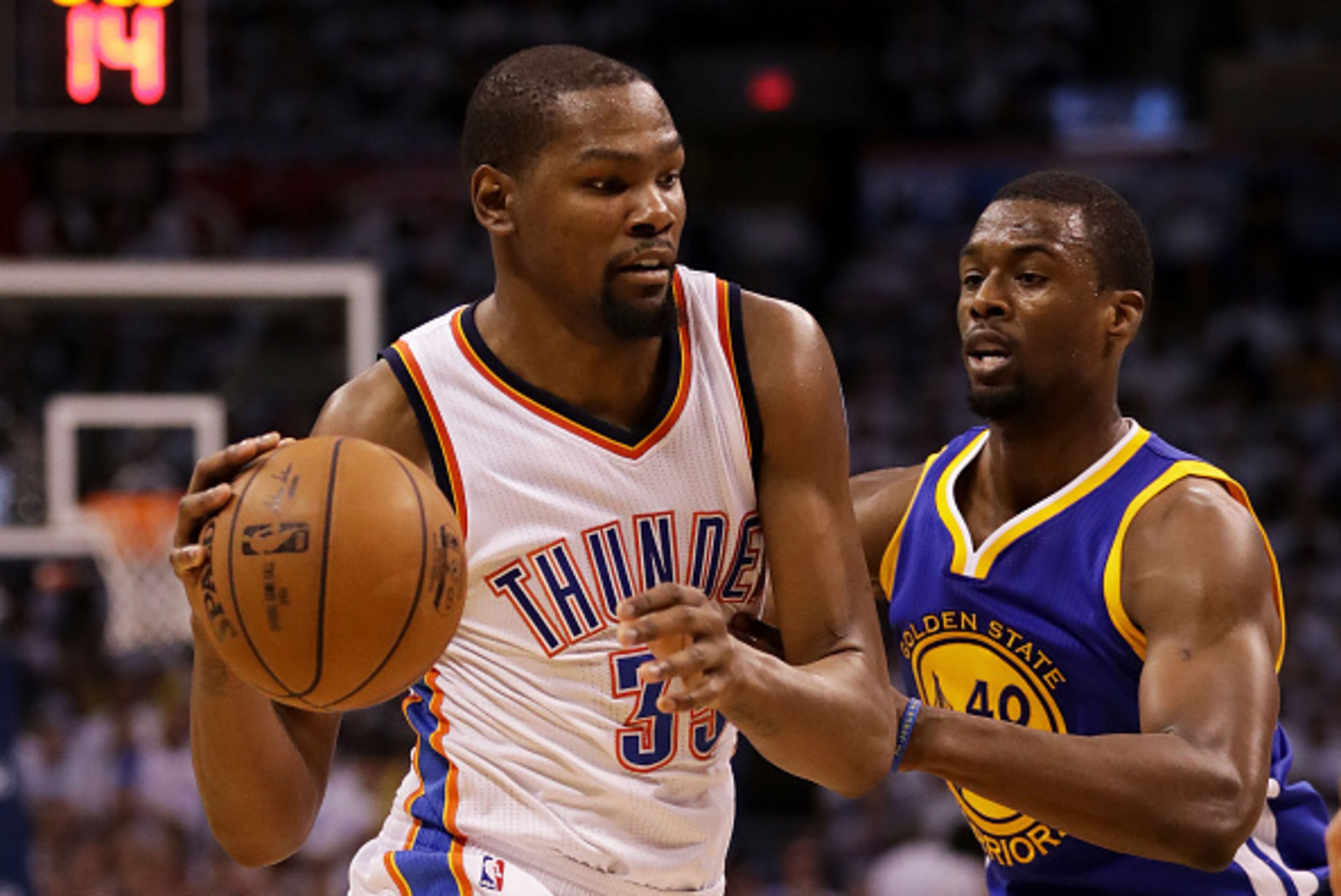 OKLAHOMA CITY, OK - MAY 24:  Kevin Durant #35 of the Oklahoma City Thunder drives against Harrison Barnes #40 of the Golden State Warriors in the third quarter in game four of the Western Conference Finals during the 2016 NBA Playoffs at Chesapeake Energy