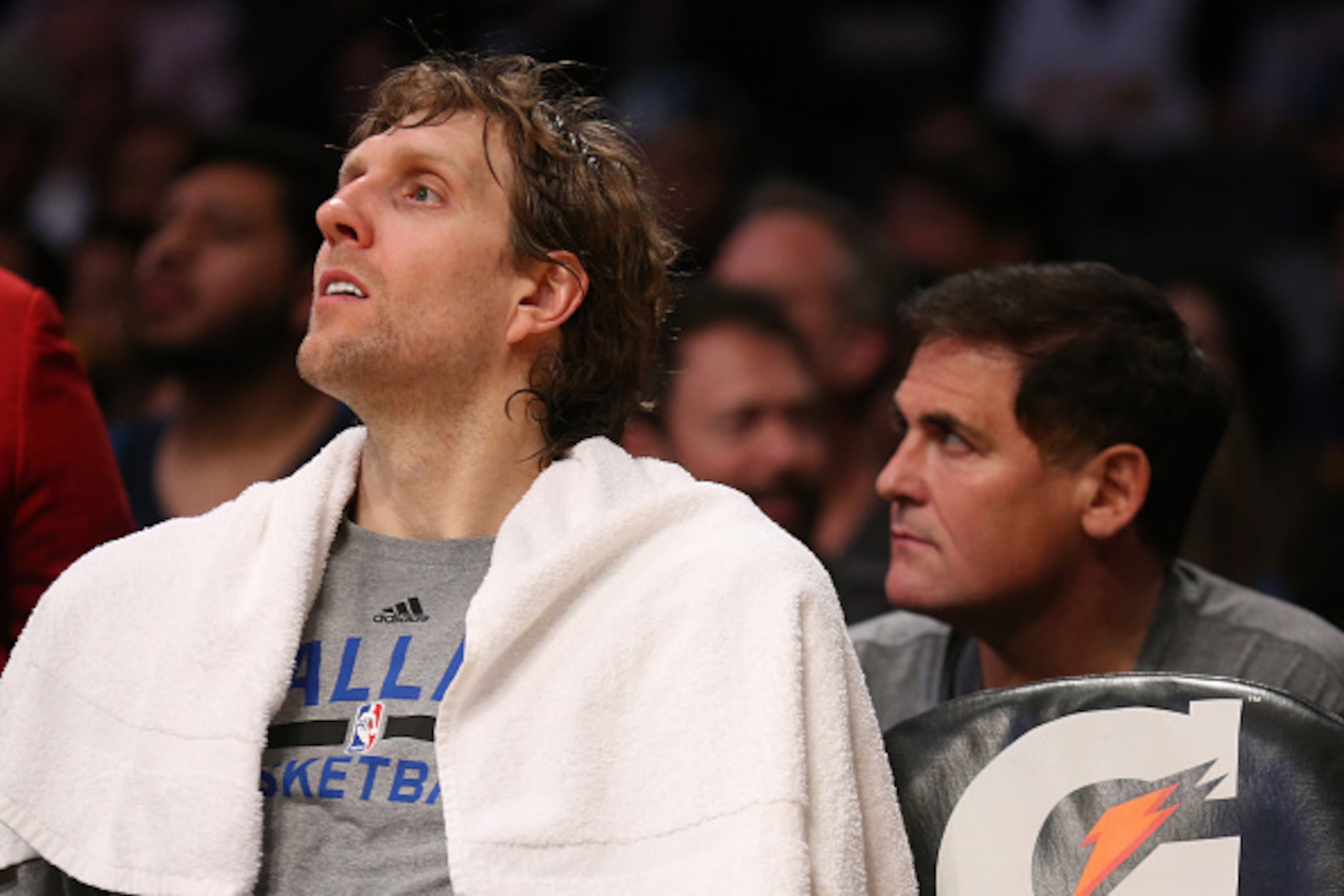 LOS ANGELES, CA - APRIL 12:  Dirk Nowitzki #41 of the Dallas Mavericks sits on the bench in front of owner Mark Cuban during the game with the Los Angeles Lakers at Staples Center on April 12, 2015 in Los Angeles, California.  The Mavericks won 120-106. N