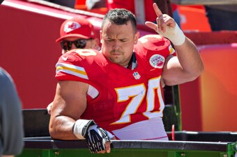 KANSAS CITY, MO - SEPTEMBER 7:  Mike DeVito #70 of the Kansas City Chiefs signals to the crowd after being taken off the field from a injury during a game against the Tennessee Titans at Arrowhead Stadium on September 7, 2014 in Kansas City, Missouri.  Th
