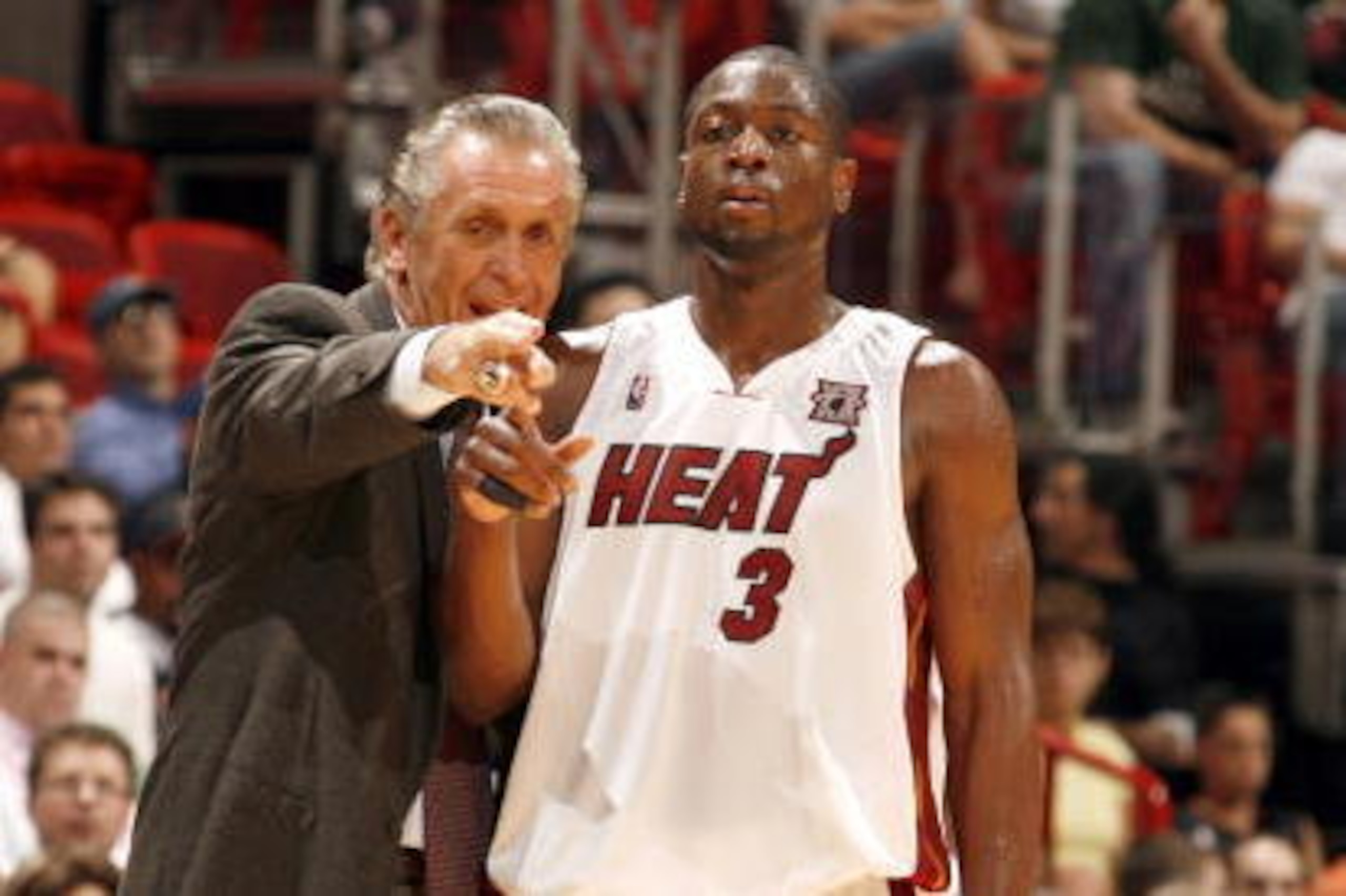 MIAMI - FEBRUARY 26: Head Coach of the Miami Heat Pat Riley leads Dwyane Wade #3 of the Miami Heat against the Sacramento Kings on February 26, 2008 at the American Airlines Arena in Miami, Florida. NOTE TO USER: User expressly acknowledges and agrees tha MIAMI - FEBRUARY 26: Head Coach of the Miami Heat Pat Riley leads Dwyane Wade #3 of the Miami Heat against the Sacramento Kings on February 26, 2008 at the American Airlines Arena in Miami, Florida. NOTE TO USER: User expressly acknowledges and agrees tha