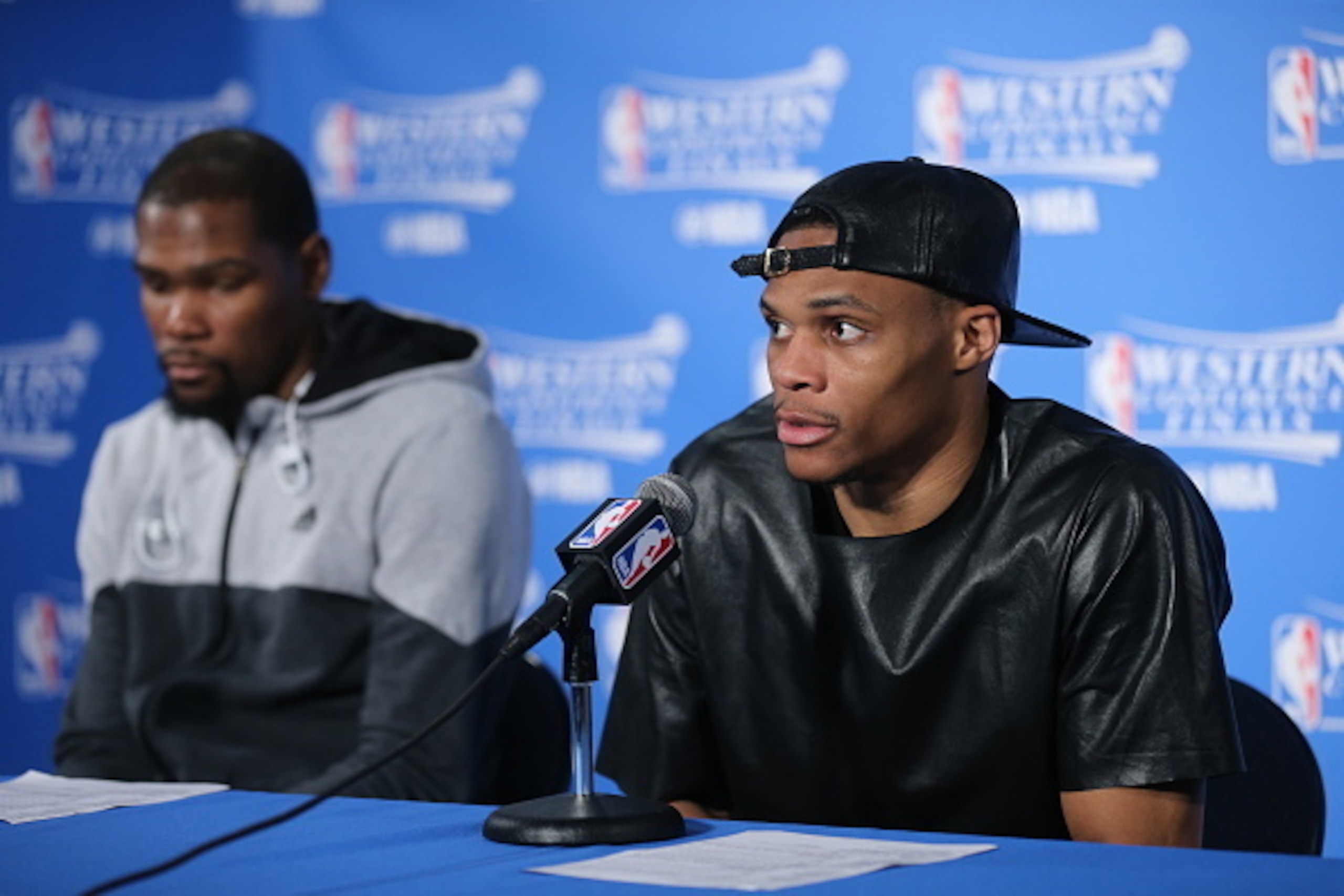 OAKLAND, CA - MAY 26:  Kevin Durant #35 and Russell Westbrook #0 of the Oklahoma City Thunder speak at a post game press conference after the game against the Golden State Warriors in Game Five of the Western Conference Finals during the 2016 NBA Playoffs