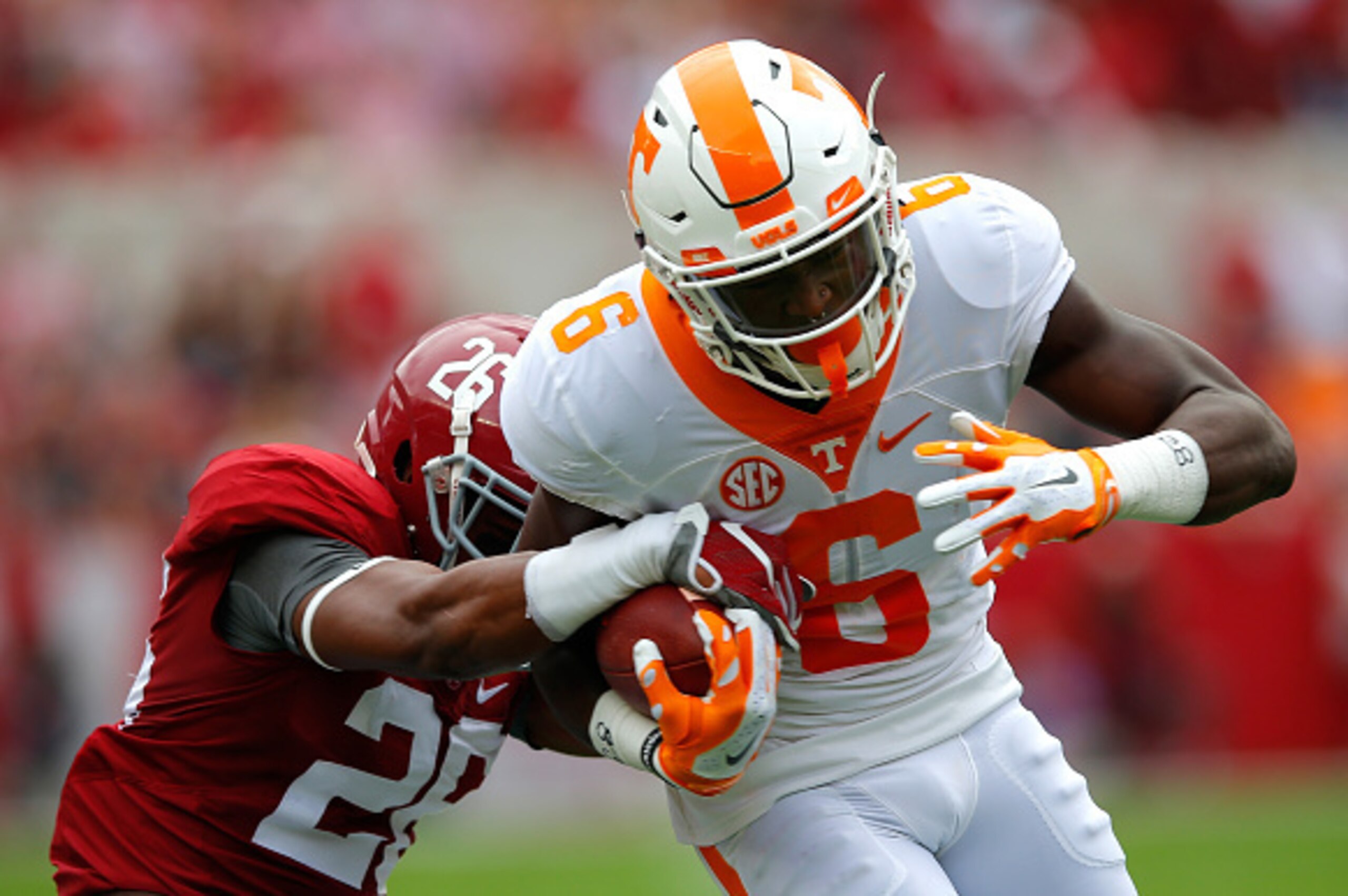 TUSCALOOSA, AL - OCTOBER 24:  Alvin Kamara #6 of the Tennessee Volunteers holds off a tackle by Marlon Humphrey #26 of the Alabama Crimson Tide at Bryant-Denny Stadium on October 24, 2015 in Tuscaloosa, Alabama.  (Photo by Kevin C. Cox/Getty Images)