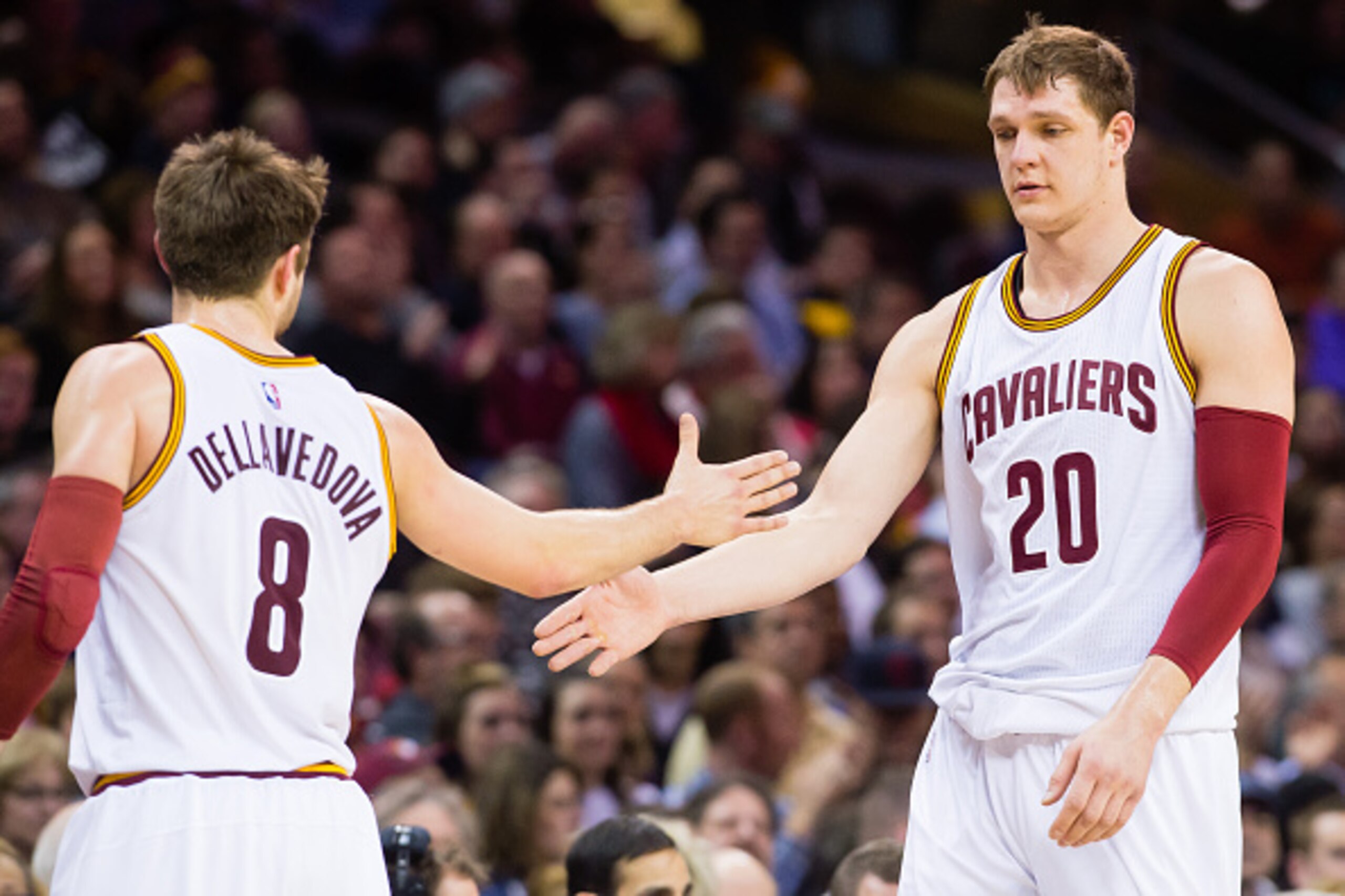 CLEVELAND, OH - JANUARY 27: Matthew Dellavedova #8 and Timofey Mozgov #20 of the Cleveland Cavaliers celebrate during the second half against the Phoenix Suns at Quicken Loans Arena on January 27, 2016 in Cleveland, Ohio. The Cavaliers defeated the Suns 1