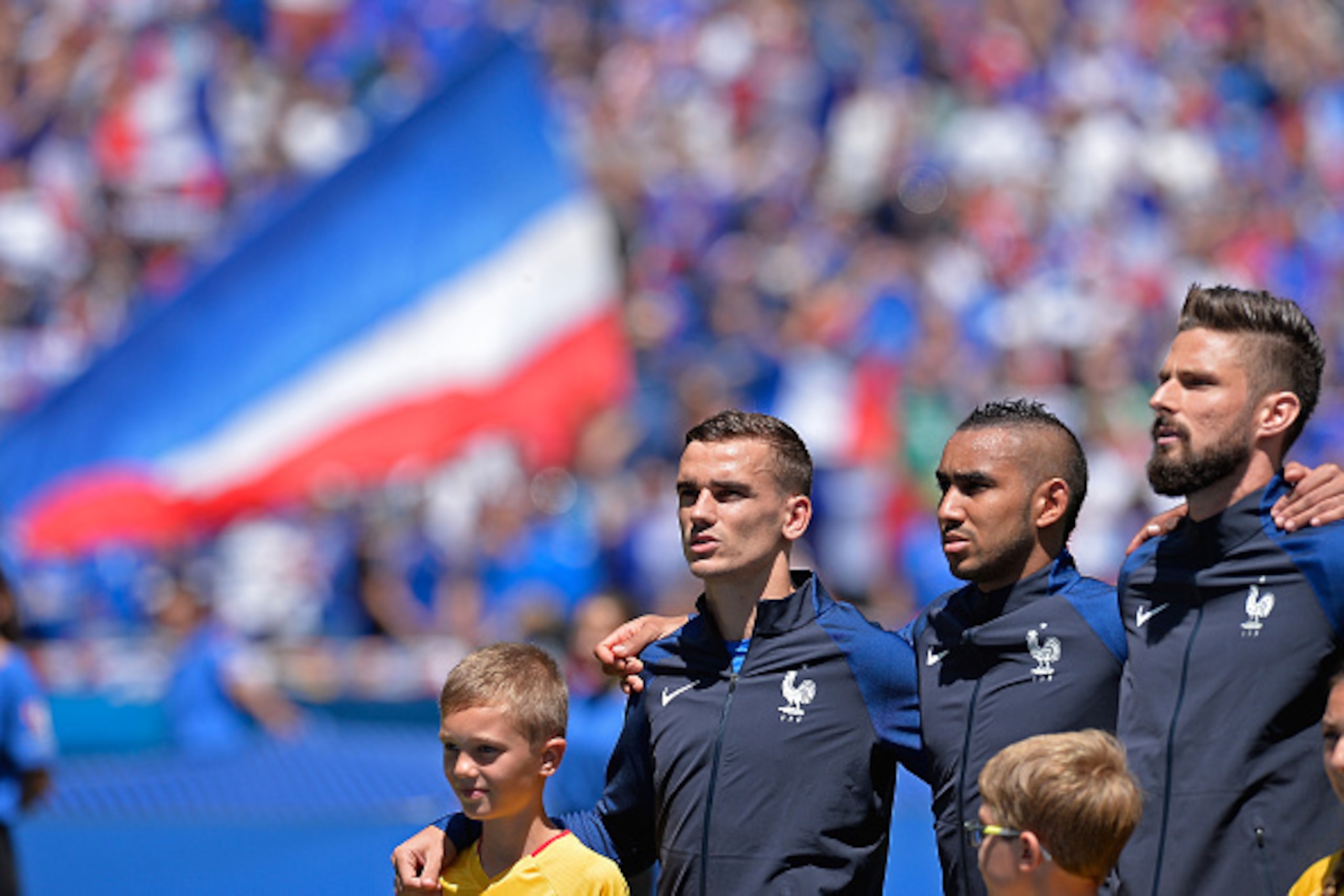 LYON, FRANCE - JUNE 26: Antoine Griezmann, Dimitri Payet, Olivier Giroud of France react during the national anthem before the UEFA Euro 2016 round of 16 match between France and the Republic of Ireland at Stade des Lumieres on June 26, 2016 in Lyon, Fra LYON, FRANCE - JUNE 26: Antoine Griezmann, Dimitri Payet, Olivier Giroud of France react during the national anthem before the UEFA Euro 2016 round of 16 match between France and the Republic of Ireland at Stade des Lumieres on June 26, 2016 in Lyon, Fra