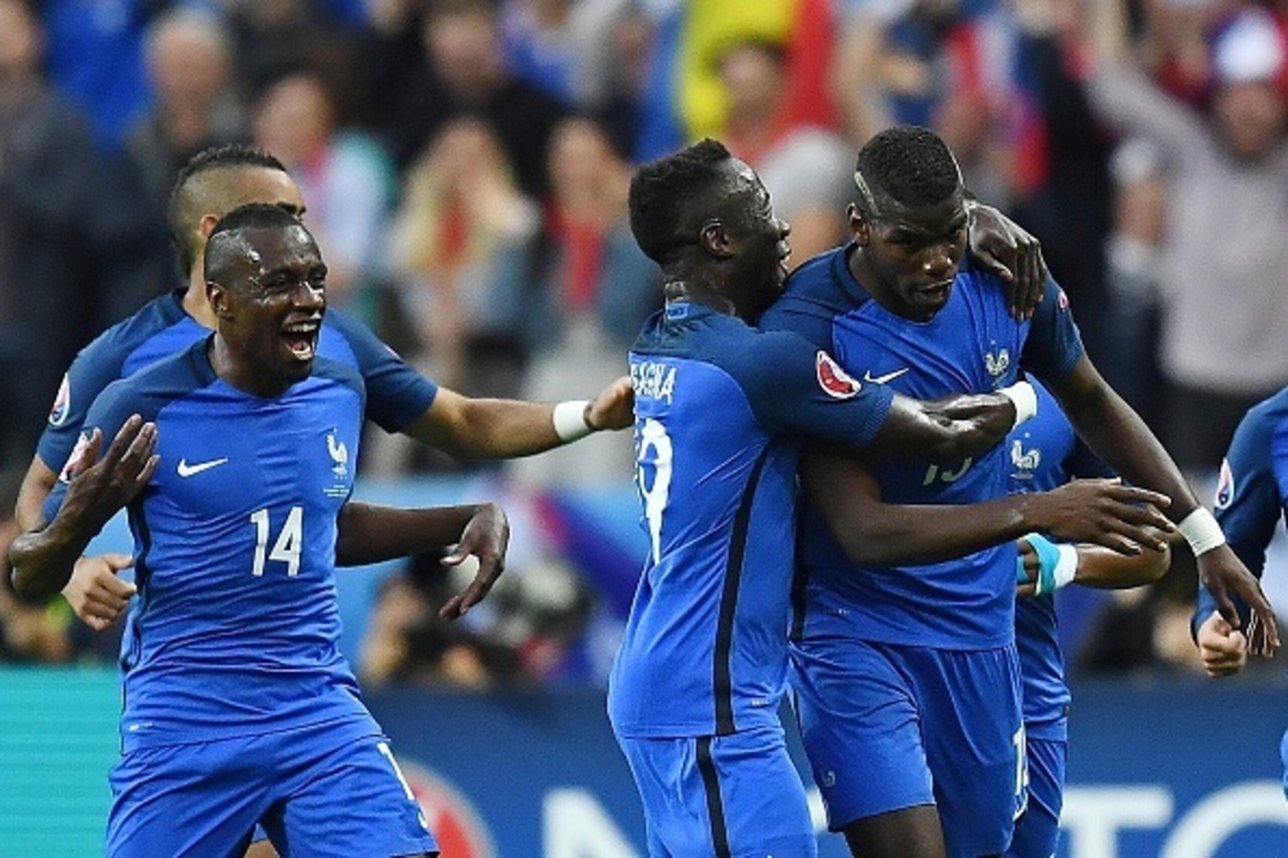 France's midfielder Blaise Matuidi, France's defender Bacary Sagna celebrate with scorer France's midfielder Paul Pogba (R-15) the team's second goal during the Euro 2016 quarter-final football match between France and Iceland at the Stade de France in Sa France's midfielder Blaise Matuidi, France's defender Bacary Sagna celebrate with scorer France's midfielder Paul Pogba (R-15) the team's second goal during the Euro 2016 quarter-final football match between France and Iceland at the Stade de France in Sa