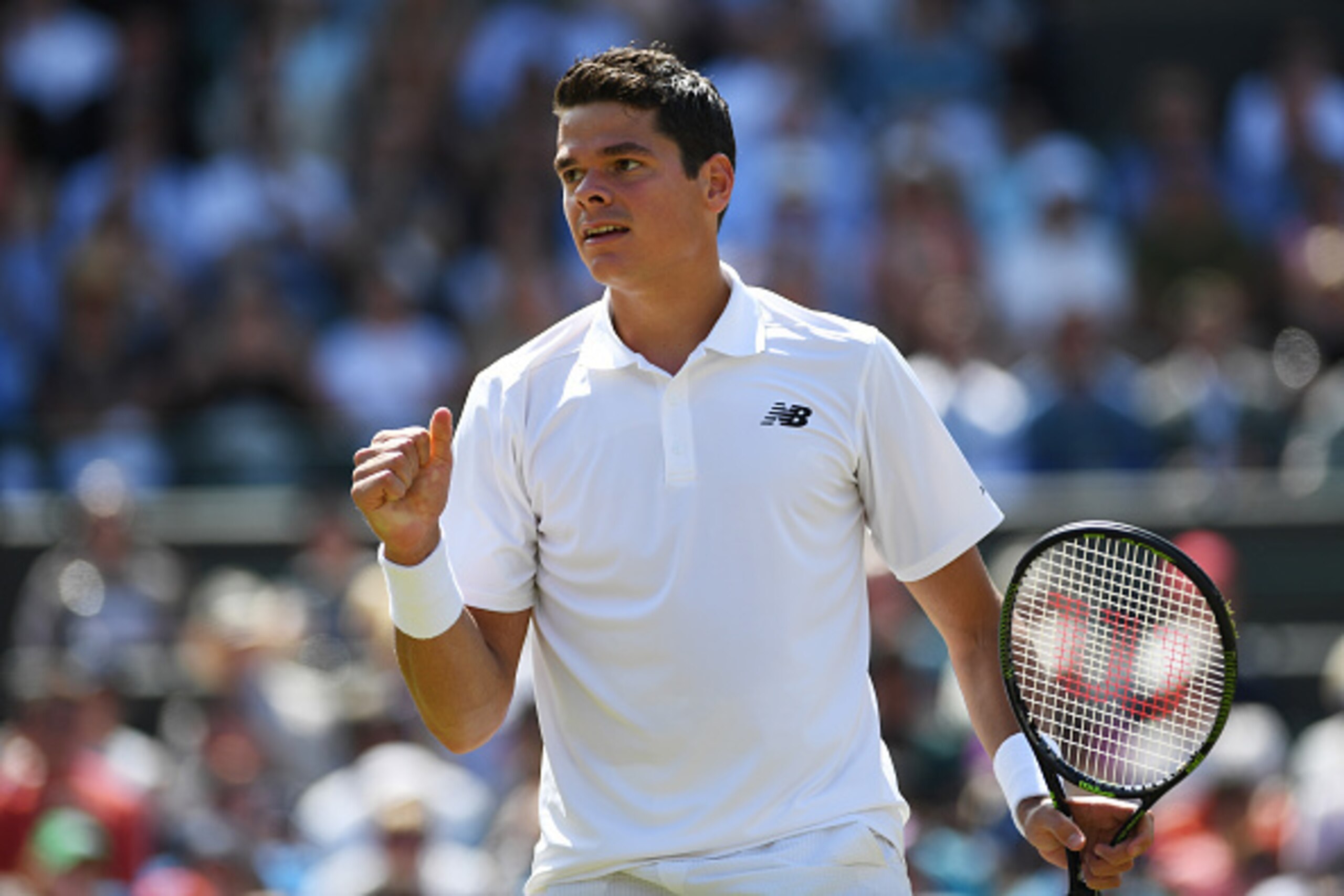 LONDON, ENGLAND - JULY 06:  Milos Raonic of Canada celebrates victory during the Men's Singles Quarter Finals match against Sam Querrey of The United States on day nine of the Wimbledon Lawn Tennis Championships at the All England Lawn Tennis and Croquet 