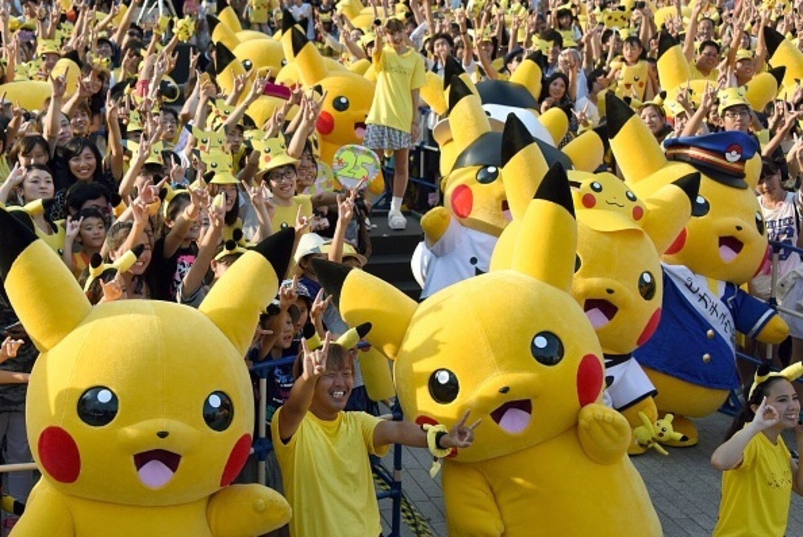 Dozens of people dressed up as Pikachu, the famous character of Nintendo's videogame software Pokemon, dance with fans as the final of a nine-day 'Pikachu Outbreak' event takes place to attract summer vacationers in Yokohama, in suburban Tokyo, on August