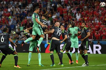 LYON, FRANCE - JULY 06:  Cristiano Ronaldo of Portugal scores the opening goal during the UEFA EURO 2016 semi final match between Portugal and Wales at Stade des Lumieres on July 6, 2016 in Lyon, France.  (Photo by Stu Forster/Getty Images)