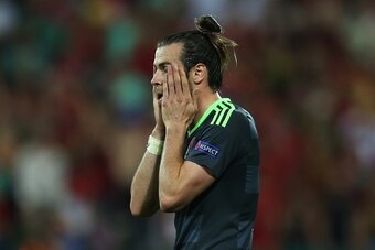 LYON, FRANCE - JULY 06: Gareth Bale of Wales looks dejected during the UEFA Euro 2016 Semi Final match between Portugal and Wales at Stade de Lyon on July 06, 2016 in Lyon, France. (Photo by Chris Brunskill Ltd/Getty Images)