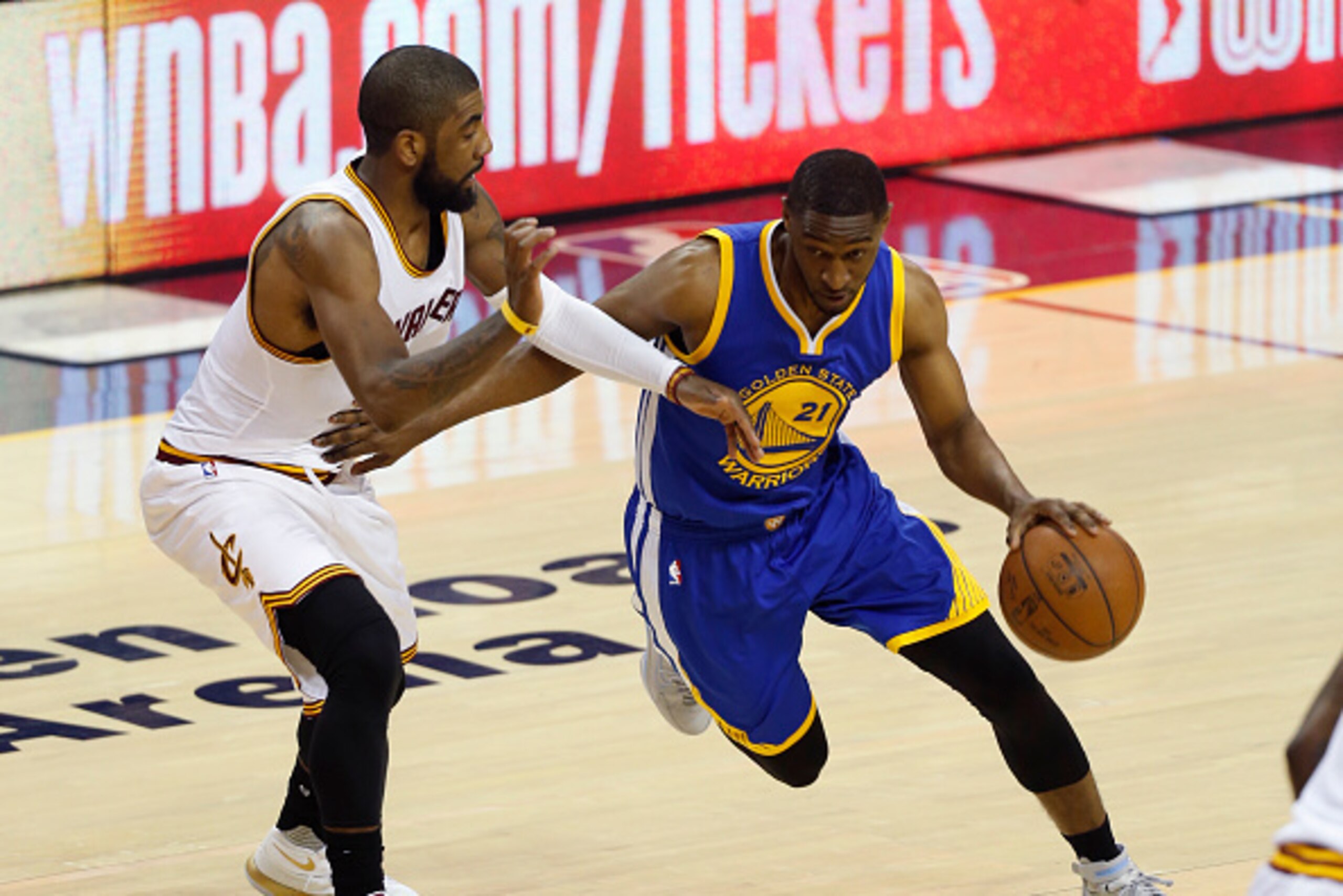 Golden State Warriors guard Ian Clark (R) tries to dribble past Cleveland Cavaliers guard Kyrie Irving (L) during Game 3 of the NBA Finals in Cleveland, Ohio on June 8, 2016. The Cavaliers won Game 3.
LeBron James scored 32 points and Kyrie Irving added 3