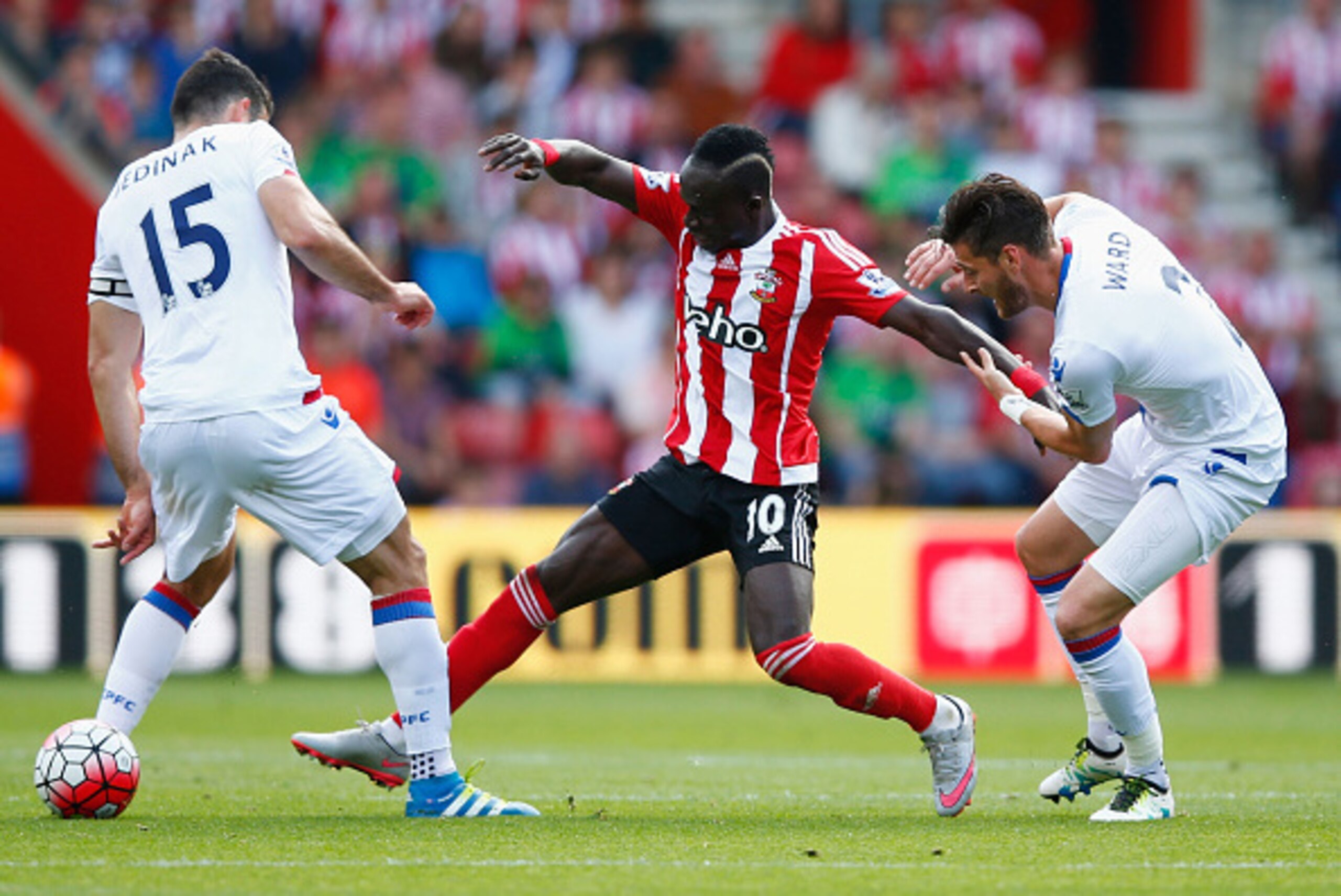 SOUTHAMPTON, ENGLAND - MAY 15: Sadio Mane (C) of Southampton competes for the ball against Mile Jedinak (L) and Joel Ward (R) of Crystal Palace during the Barclays Premier League match between Southampton and Crystal Palace at St Mary's Stadium on May 15,