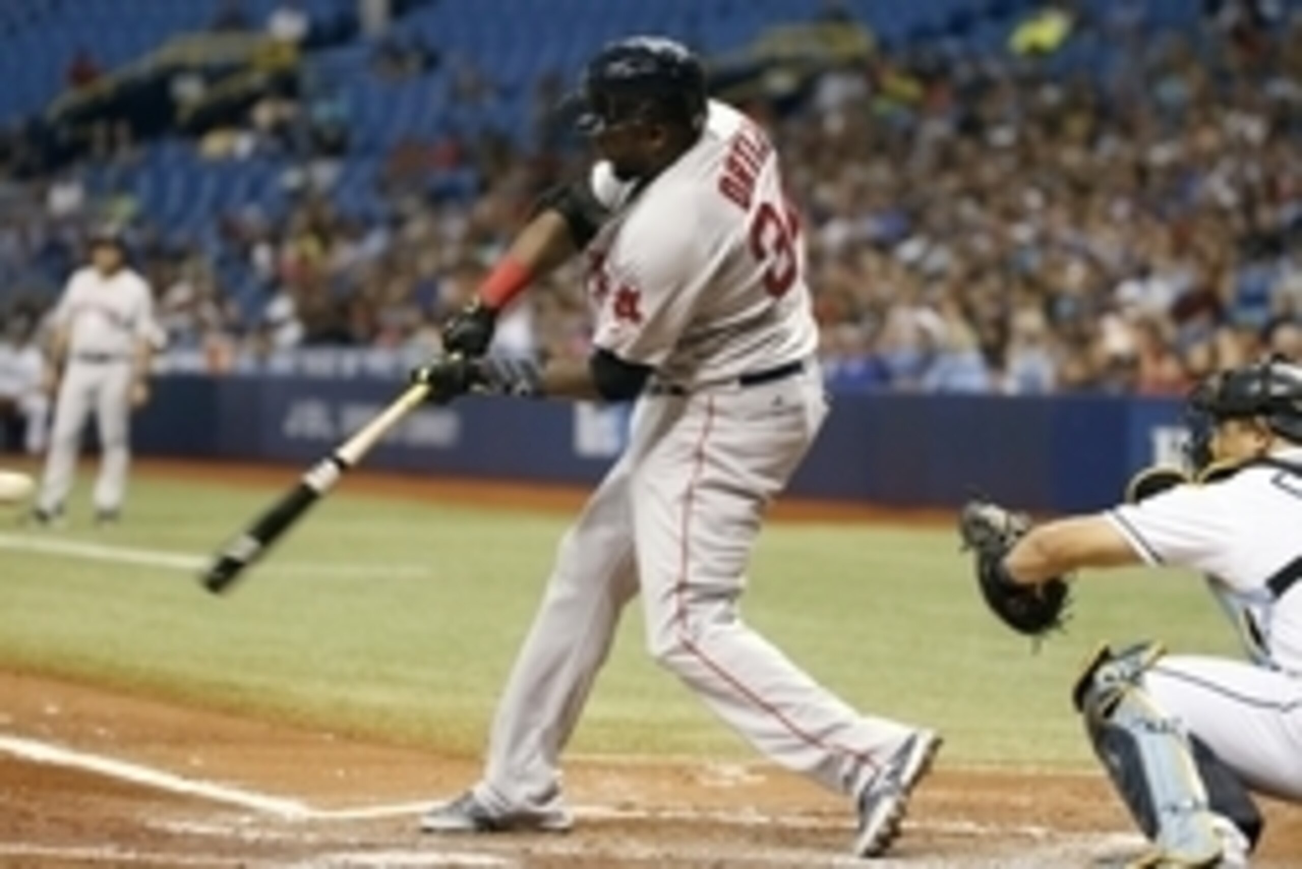 Jun 28, 2016; St. Petersburg, FL, USA; Boston Red Sox designated hitter David Ortiz (34) hits a RBI double during the third inning against the Tampa Bay Rays at Tropicana Field. Mandatory Credit: Kim Klement-USA TODAY Sports
