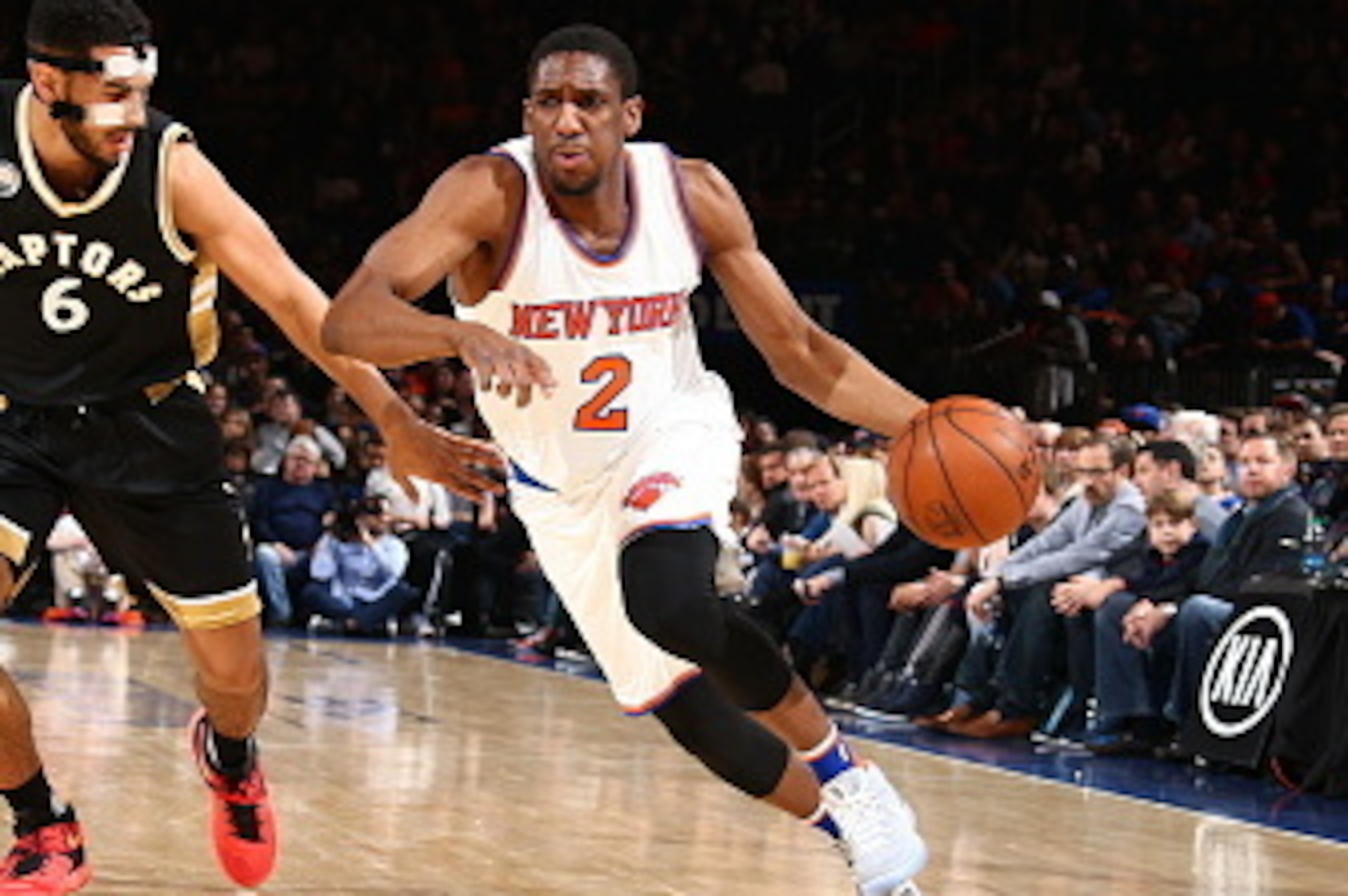 NEW YORK, NY - APRIL 10:  Langston Galloway #2 of the New York Knicks drives to the basket against Cory Joseph #6 of the Toronto Raptors on April 10, 2016 at Madison Square Garden in New York City.  NOTE TO USER: User expressly acknowledges and agrees tha