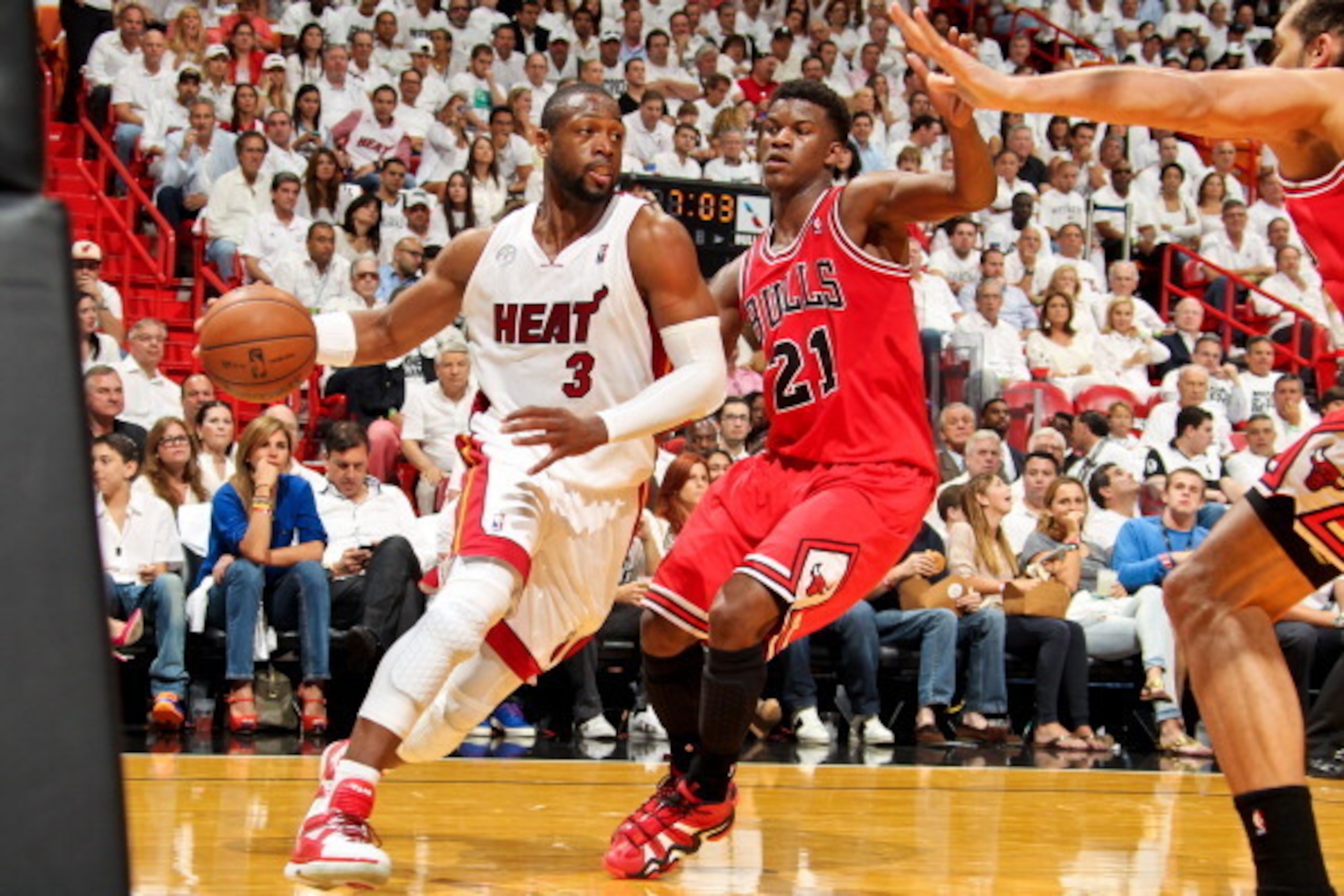 MIAMI, FL - MAY 15: Dwyane Wade #3 of the Miami Heat drives baseline against Jimmy Butler #21 of the Chicago Bulls in Game Five of the Eastern Conference Semifinals during the 2013 NBA Playoffs on May 15, 2013 at American Airlines Arena in Miami, Florida.