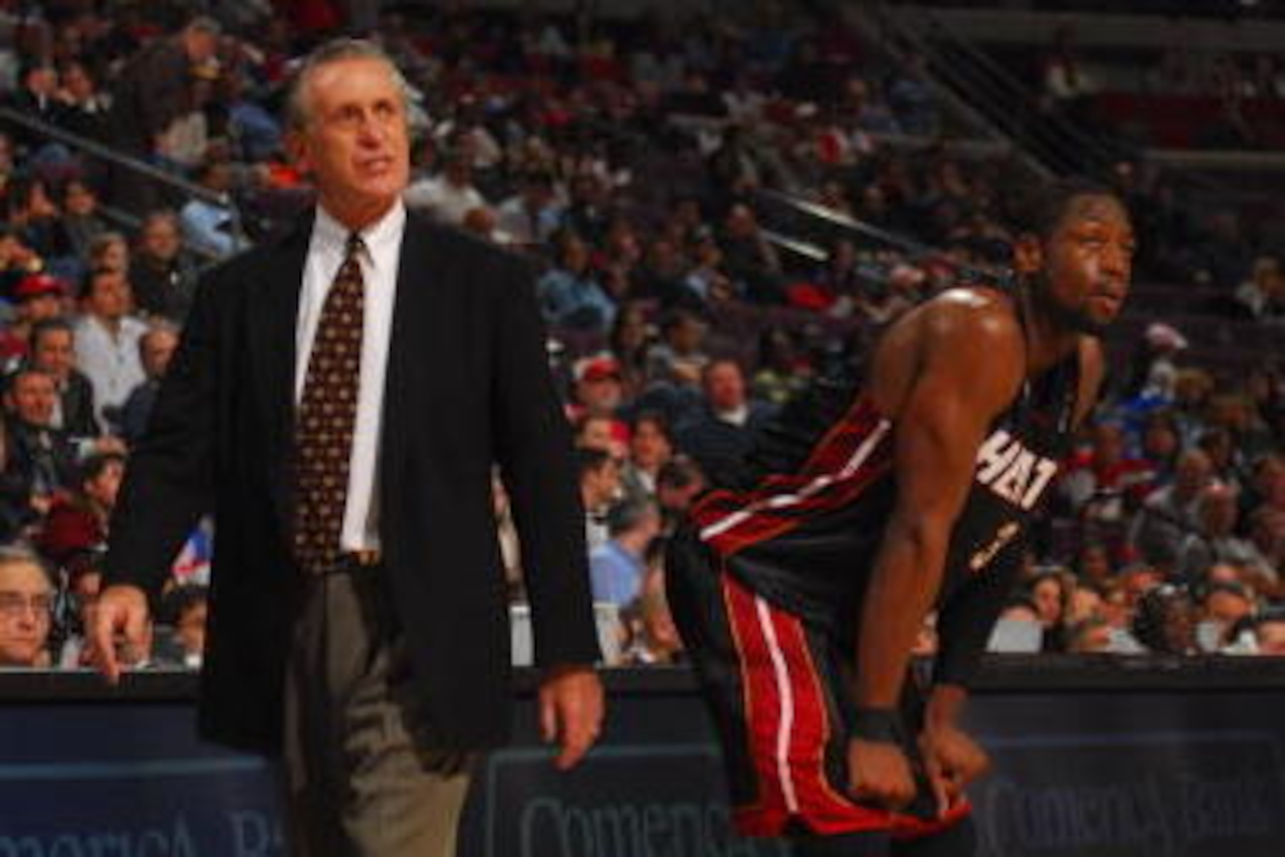 AUBURN HILLS, MI - FEBRUARY 6: Head Coach Pat Riley and Dwyane Wade #3 of the Miami Heat during a game against the Detroit Pistons on February 6, 2008 at the Palace of Auburn Hills in Auburn Hills, Michigan. NOTE TO USER: User expressly acknowledges and AUBURN HILLS, MI - FEBRUARY 6: Head Coach Pat Riley and Dwyane Wade #3 of the Miami Heat during a game against the Detroit Pistons on February 6, 2008 at the Palace of Auburn Hills in Auburn Hills, Michigan. NOTE TO USER: User expressly acknowledges and