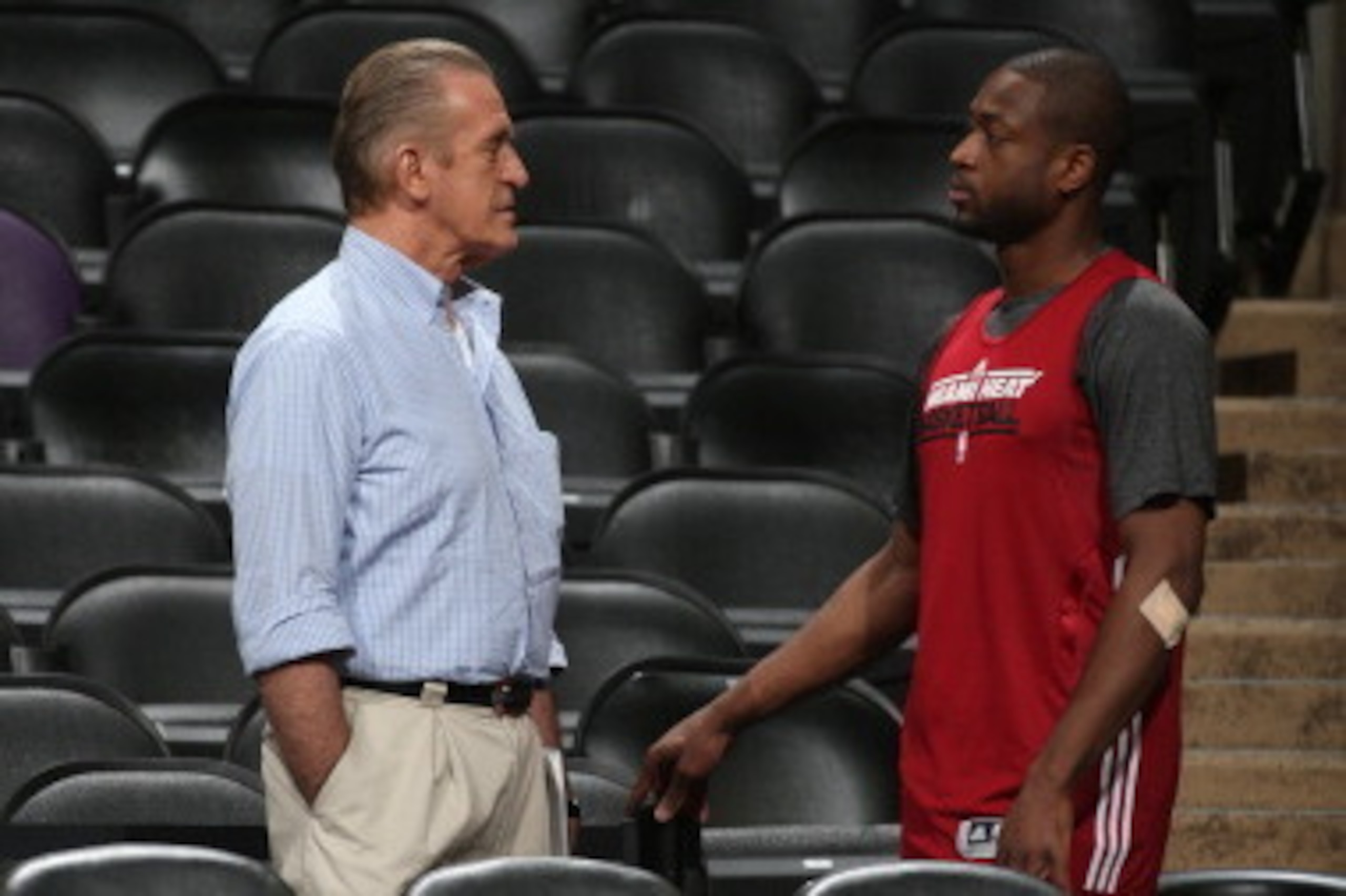 SAN ANTONIO, TX - JUNE 12: Pat Riley, Team President of the Miami Heat and Dwyane Wade view practice as part of the 2013 NBA Finals on June 12, 2013 at AT&T Center in San Antonio, Texas. NOTE TO USER: User expressly acknowledges and agrees that, by downlo
