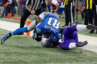 DETROIT, MI - OCTOBER 25: Calvin Johnson #81 of the Detroit Lions catches a touchdown pass in front of Xavier Rhodes #29 of the Minnesota Vikings in the first quarter during an NFL game at Ford Field on October 25, 2015 in Detroit, Michigan. (Photo by Dav