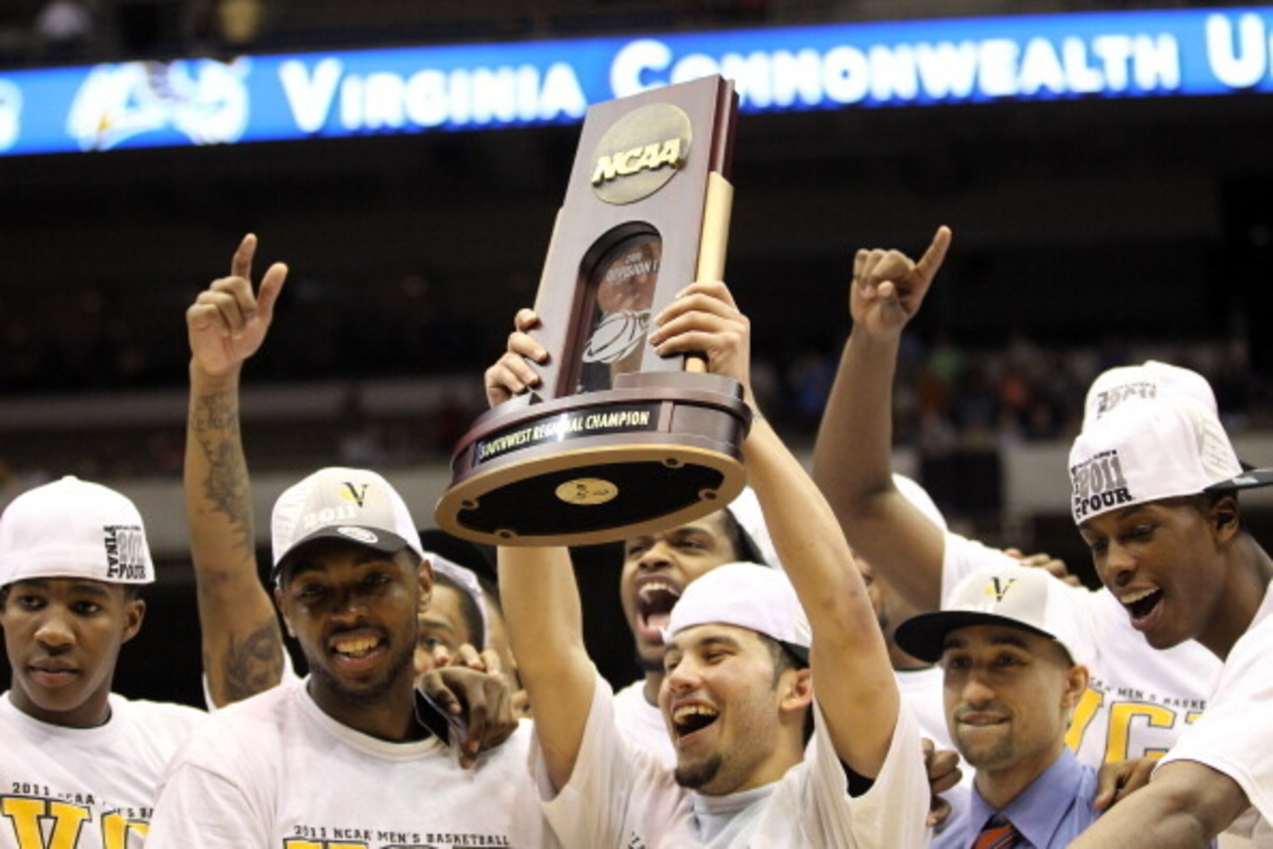 SAN ANTONIO, TX - MARCH 27:  Joey Rodriguez #12 of the Virginia Commonwealth Rams holds up the trophy after defeating the Kansas Jayhawks during the southwest regional final of the 2011 NCAA men's basketball tournament at the Alamodome on March 27, 2011 i