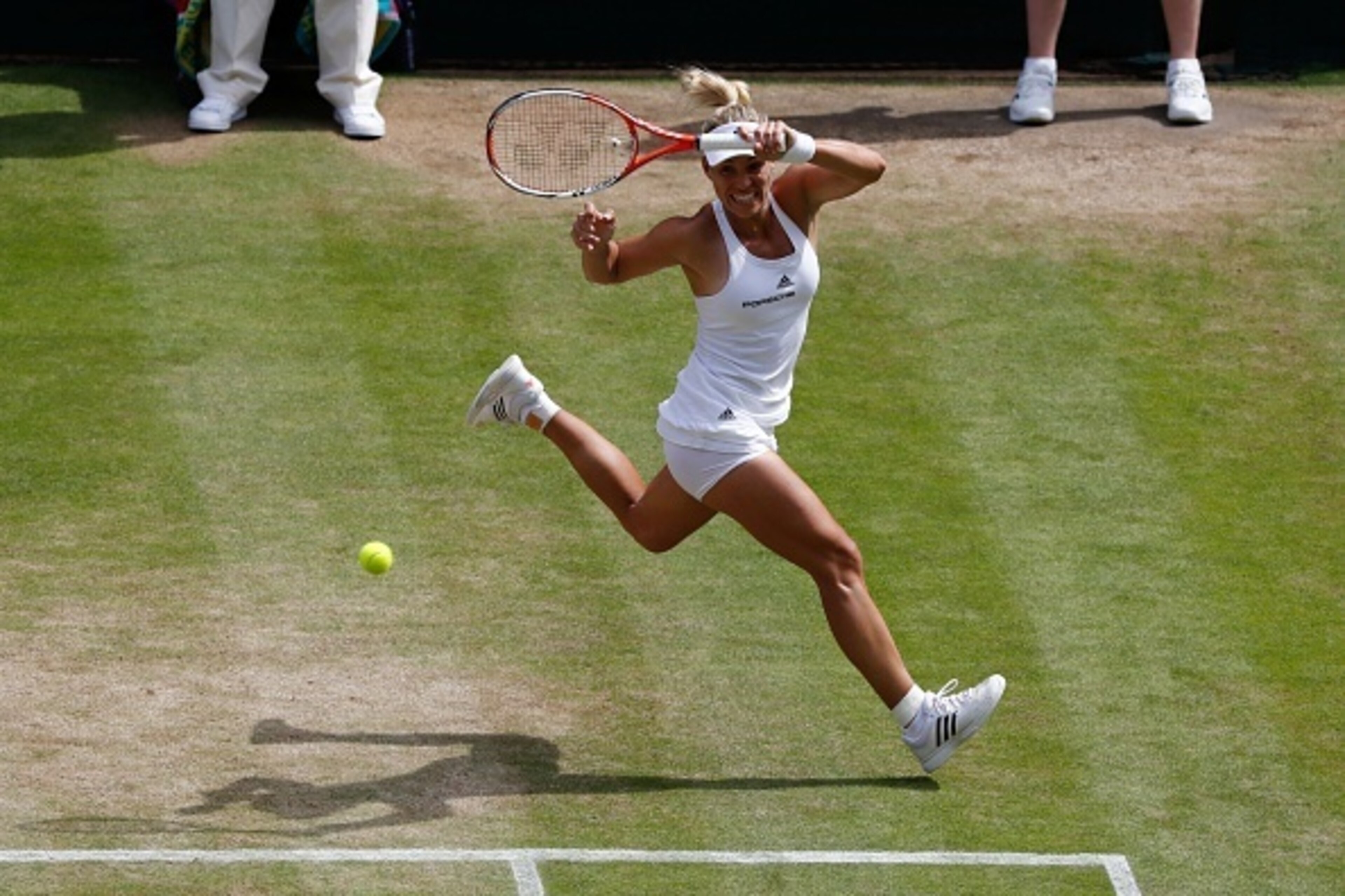 Germany's Angelique Kerber returns to US player Venus Williams during their women's semi-final match on the eleventh day of the 2016 Wimbledon Championships at The All England Lawn Tennis Club in Wimbledon, southwest London, on July 7, 2016. / AFP / POOL 