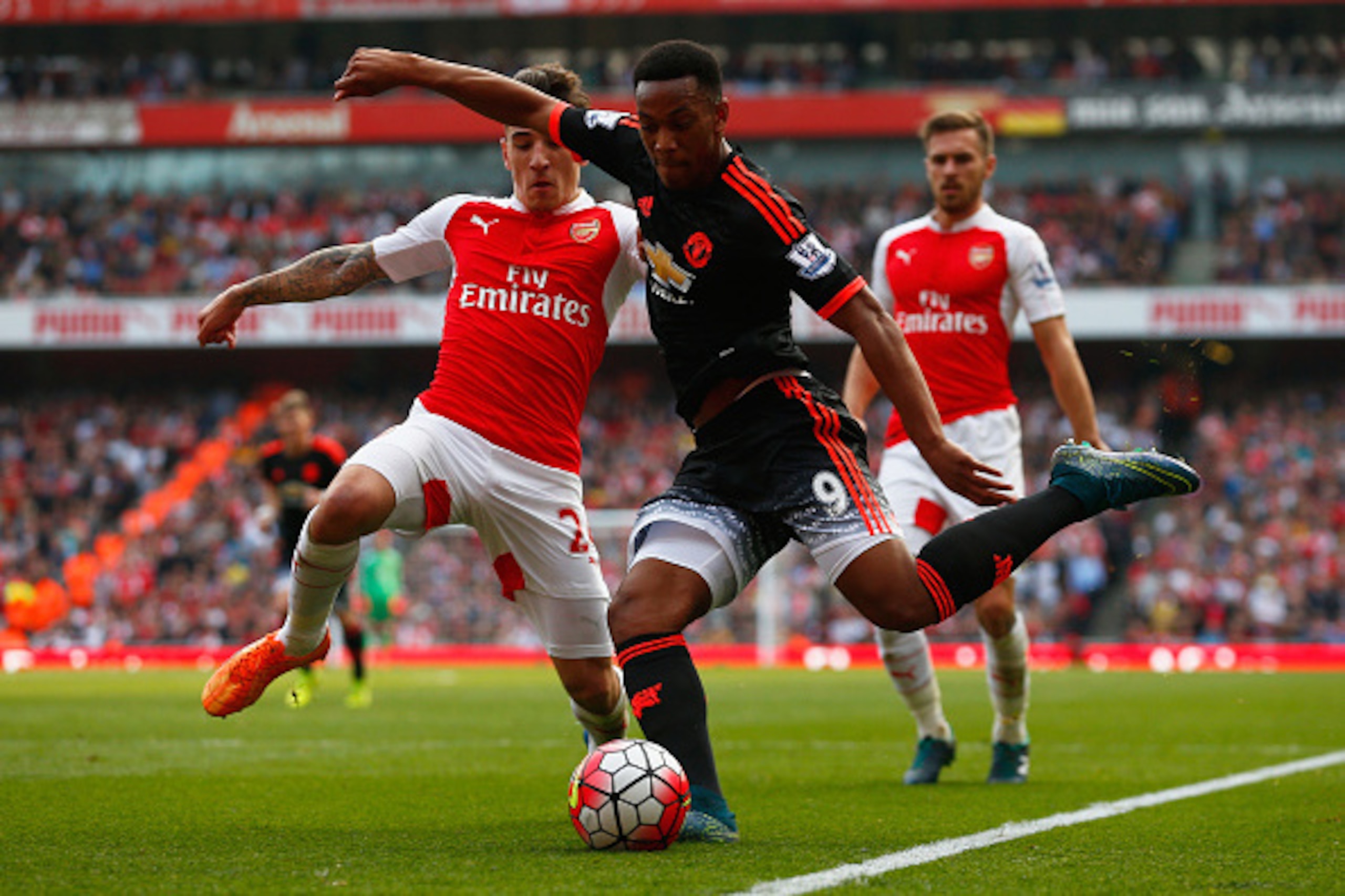 LONDON, ENGLAND - OCTOBER 04: Anthony Martial of Manchester United and Hector Bellerin of Arsenal in action during the Barclays Premier League match between Arsenal and Manchester United at Emirates Stadium on October 4, 2015 in London, England.  (Photo b