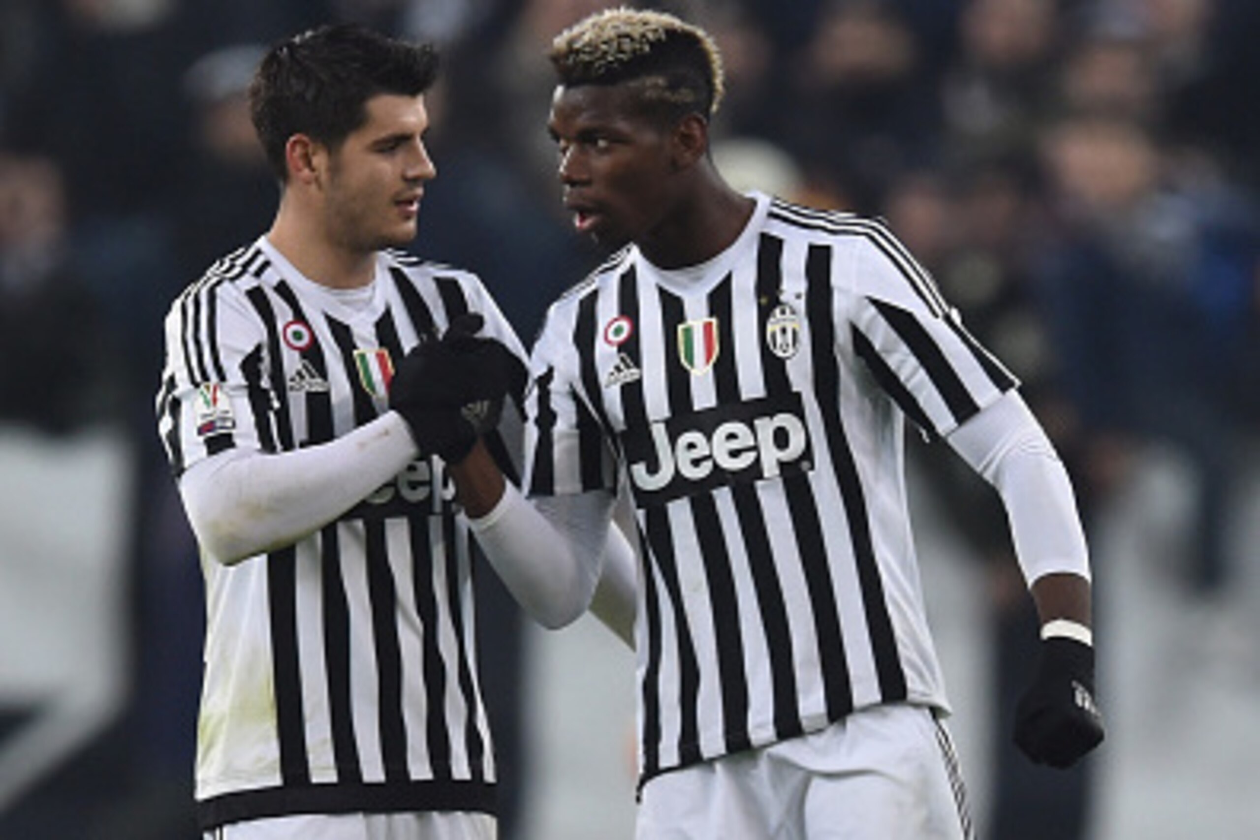 TURIN, ITALY - DECEMBER 16:  Paul Pogba (R) of FC Juventus celebrates his goal with team mate Alvaro Morata during the TIM Cup match between FC Juventus and Torino FC at Juventus Arena on December 16, 2015 in Turin, Italy.  (Photo by Valerio Pennicino/Get