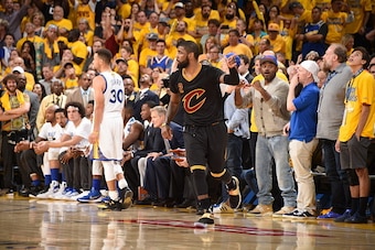 OAKLAND, CA - JUNE 19:  Kyrie Irving #2 of the Cleveland Cavaliers celebrates after hitting the go ahead three pointer in Game Seven of the 2016 NBA Finals against the Golden State Warriors on June 19, 2016 at ORACLE Arena in Oakland, California. NOTE TO 