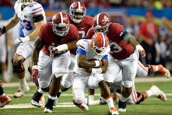Dec 5, 2015; Atlanta, GA, USA; Florida Gators quarterback Treon Harris (3) is sacked by Alabama Crimson Tide defensive lineman Jonathan Allen (93) and teammates during the second quarter of the 2015 SEC Championship Game at the Georgia Dome. Mandatory Cre
