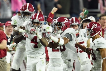 Jan 11, 2016; Glendale, AZ, USA; Alabama Crimson Tide defensive back Eddie Jackson (4) celebrates with teammates after an interception against the Clemson Tigers in the second quarter in the 2016 CFP National Championship at University of Phoenix Stadium.