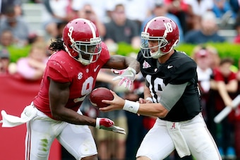 Apr 16, 2016; Tuscaloosa, AL, USA; Alabama Crimson Tide quarterback Cooper Bateman (18) hands the ball off too Alabama Crimson Tide running back Bo Scarbrough (9) at Bryant-Denny Stadium. Mandatory Credit: Marvin Gentry-USA TODAY Sports