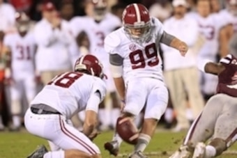 Nov 14, 2015; Starkville, MS, USA; Alabama Crimson Tide place kicker Adam Griffith (99) attempts a field goal during the game against Mississippi State Bulldogs at Davis Wade Stadium. The Crimson Tide defeated the Bulldogs 31-6. Mandatory Credit: Marvin G