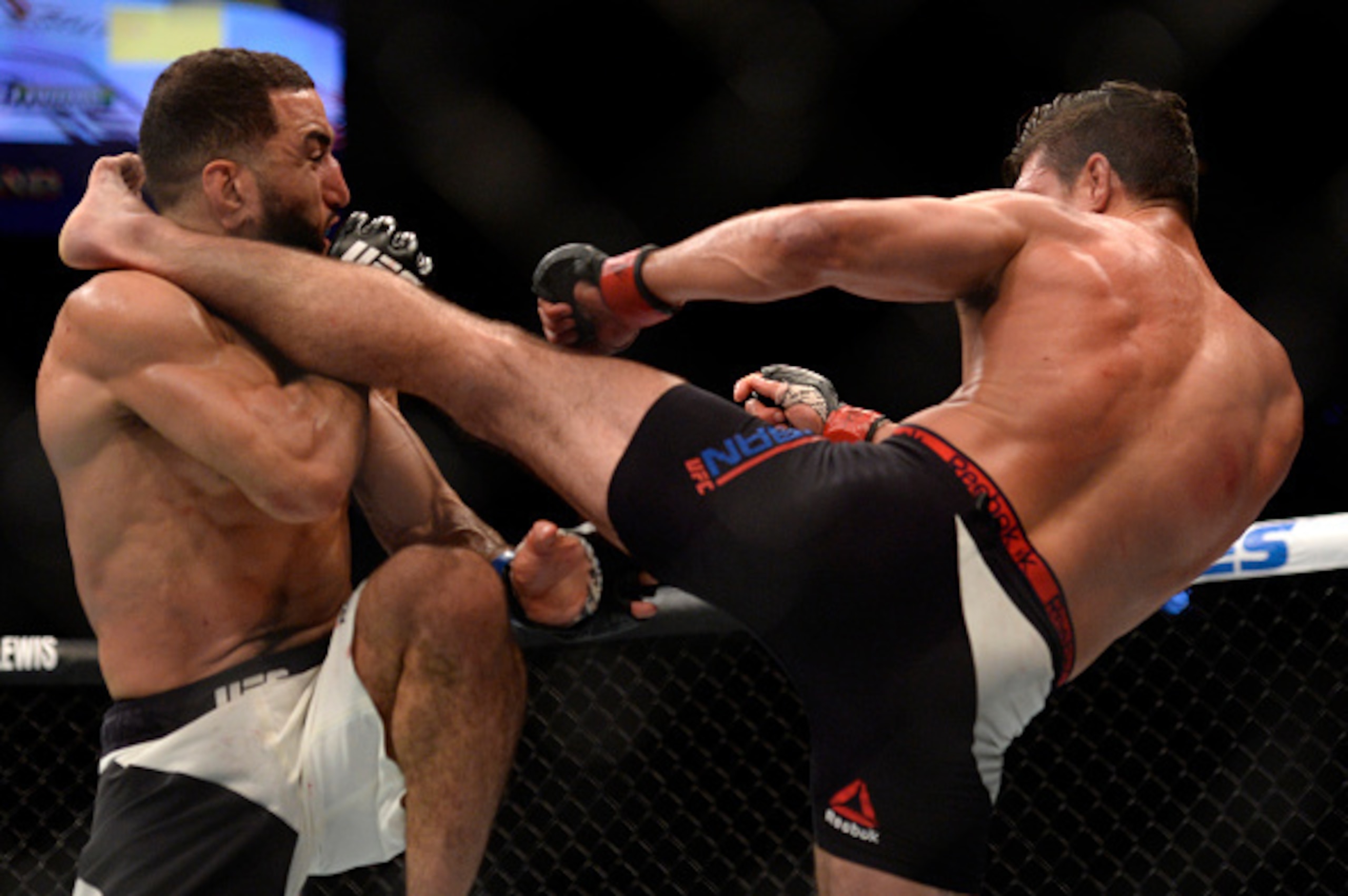 LAS VEGAS, NV - JULY 07:   (R-L) Alan Jouban kicks Belal Muhammad in their welterweight bout during the UFC Fight Night event inside the MGM Grand Garden Arena on July 7, 2016 in Las Vegas, Nevada. (Photo by Brandon Magnus/Zuffa LLC/Zuffa LLC via Getty Im