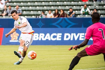 CARSON, CA - OCTOBER 4: Hirving Lozano #17 of Mexico takes a shot on goal as Luis Odelus #1 of Haiti prepares to make a save during Mexico's Olympic Qualifying match against Haiti at the StubHub Center on October 4, 2015 in Carson, California. Mexico won CARSON, CA - OCTOBER 4: Hirving Lozano #17 of Mexico takes a shot on goal as Luis Odelus #1 of Haiti prepares to make a save during Mexico's Olympic Qualifying match against Haiti at the StubHub Center on October 4, 2015 in Carson, California. Mexico won