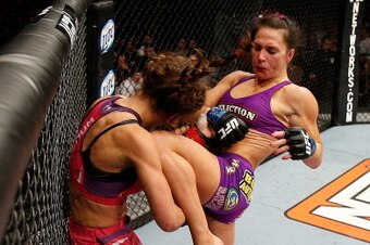 LAS VEGAS, NV - APRIL 13:   (R-L) Cat Zingano knees Miesha Tate in their bantamweight fight at the Mandalay Bay Events Center  on April 13, 2013 in Las Vegas, Nevada.  (Photo by Josh Hedges/Zuffa LLC/Zuffa LLC via Getty Images)