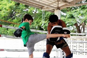 Brayden trains in Thailand.